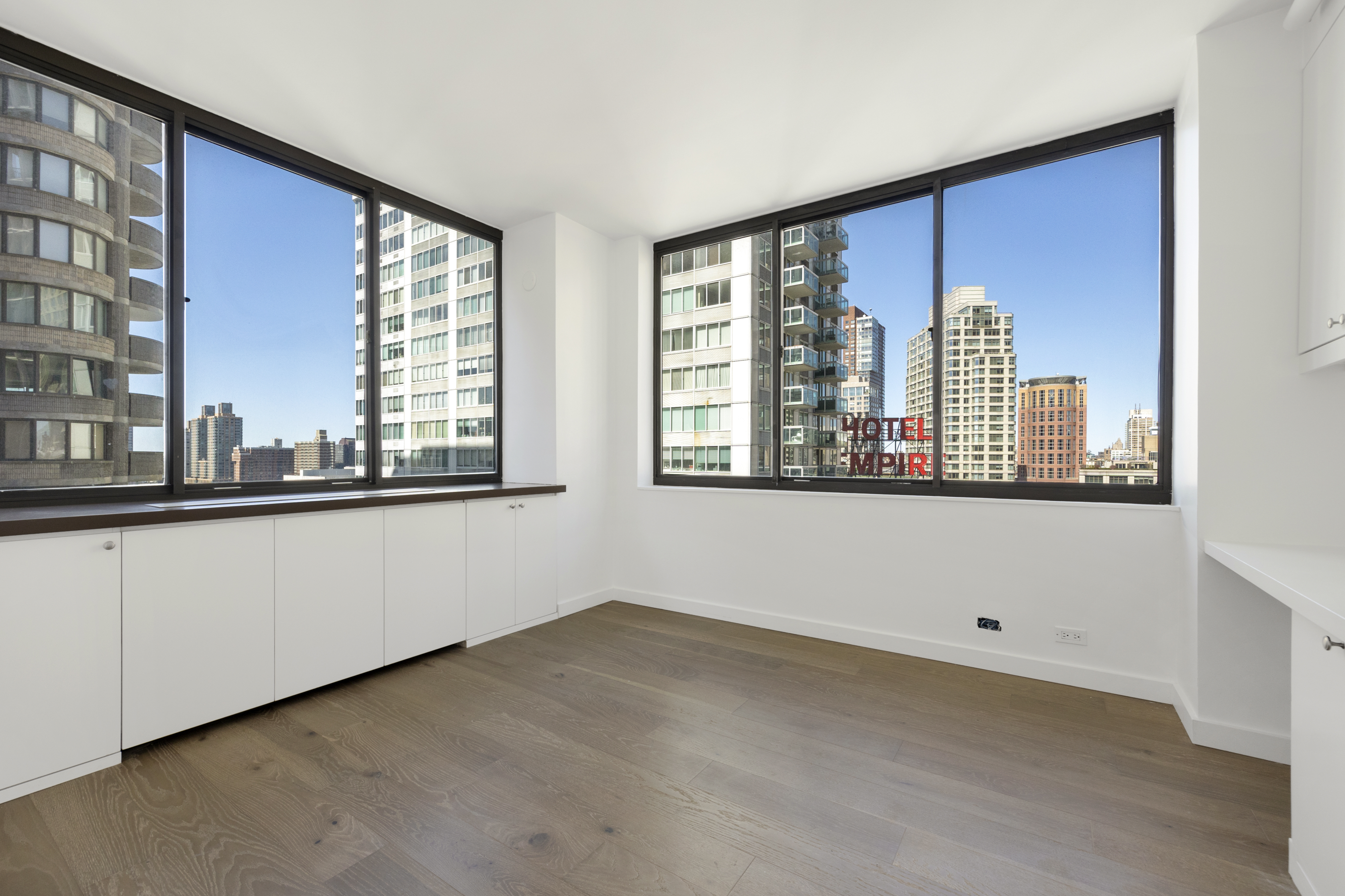 62 West 62nd Street, Unit 18A Manhattan, NY 10023 - Photo 1 of 16 a view of an empty room with a window