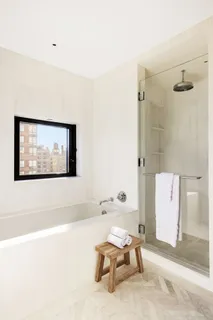 a living room with a couch and a painting on the wall