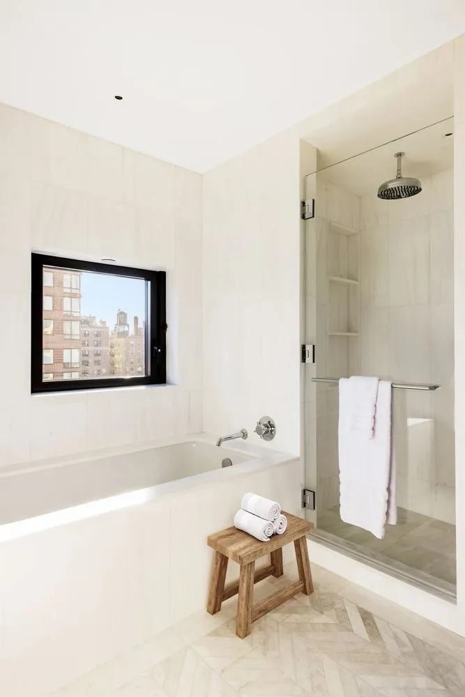 a living room with a couch and a painting on the wall