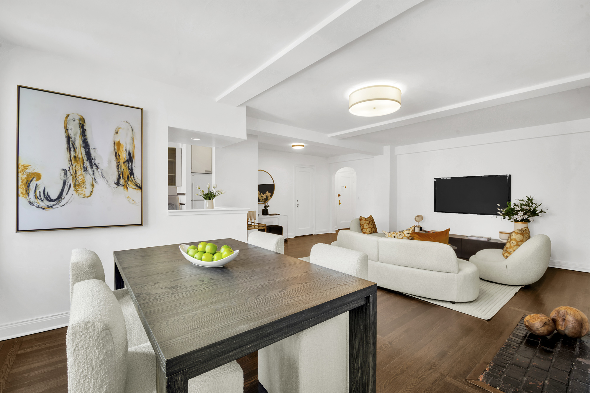 59 West 12th Street, Unit 6A Manhattan, NY 10011 - Photo 4 of 11 a view of a dining room with furniture and a flat screen tv