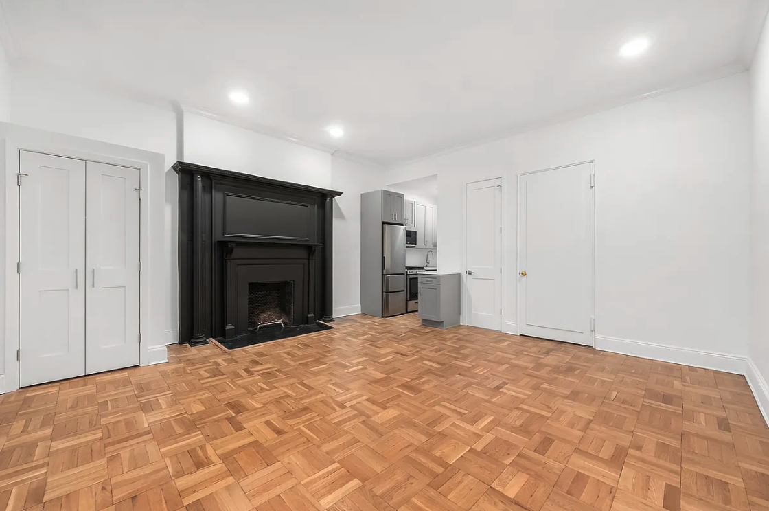 134 West 80th Street, Unit 2R Manhattan, NY 10024 - Photo 2 of 7 a view of an empty room with a fireplace