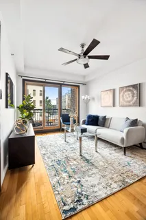 a living room with furniture and a rug