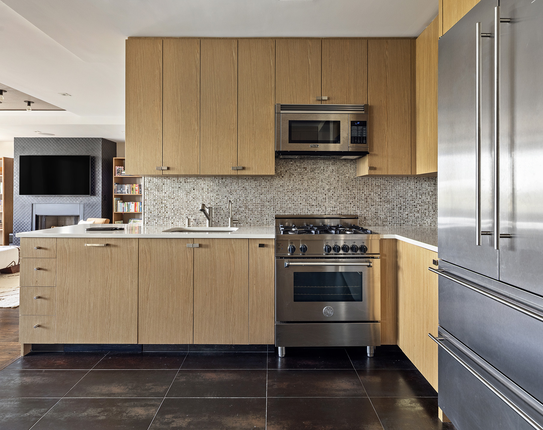 167 Perry Street, Unit 4NQ Manhattan, NY 10014 - Photo 5 of 20 a kitchen with stainless steel appliances granite countertop a stove a microwave and a sink