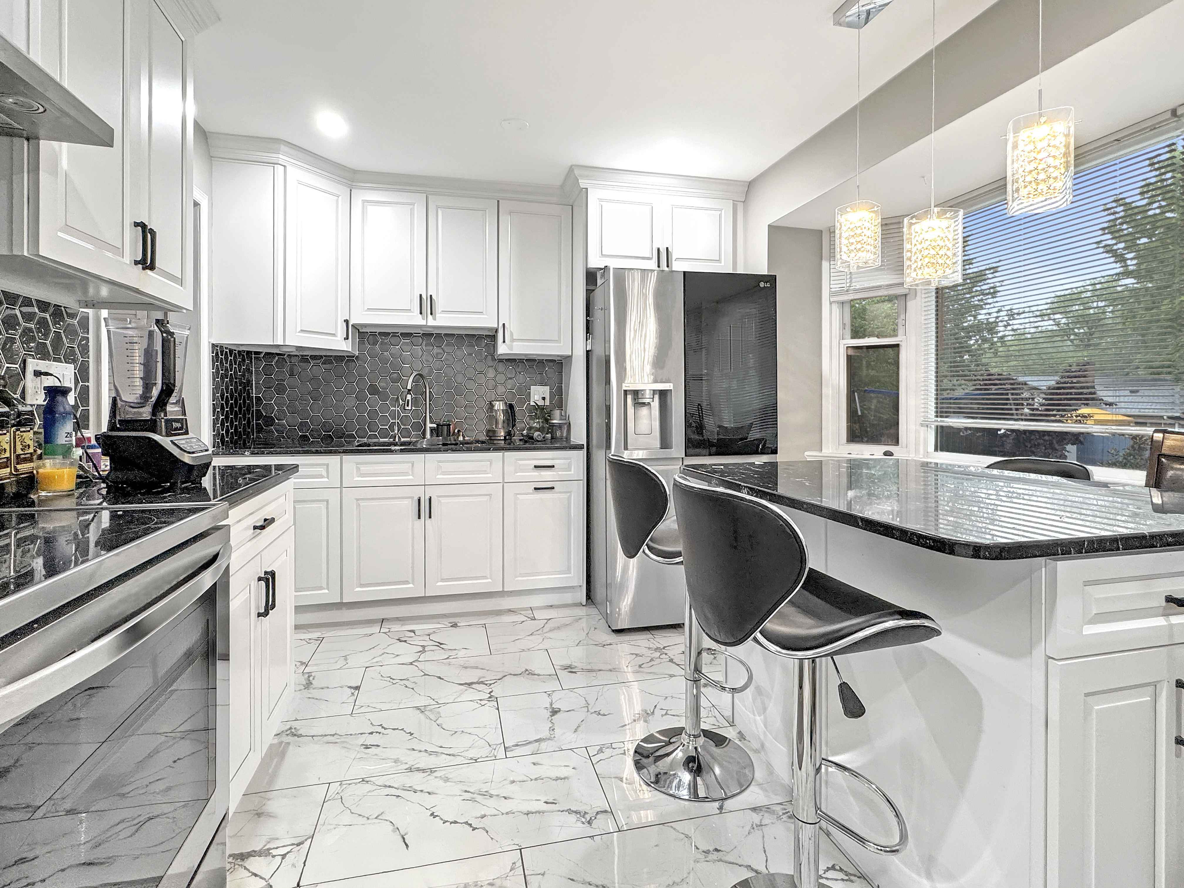 2408 Lillian Drive Silver Spring, MD 20902 - Photo 11 of 40 a kitchen with granite countertop a counter space a sink appliances and cabinets