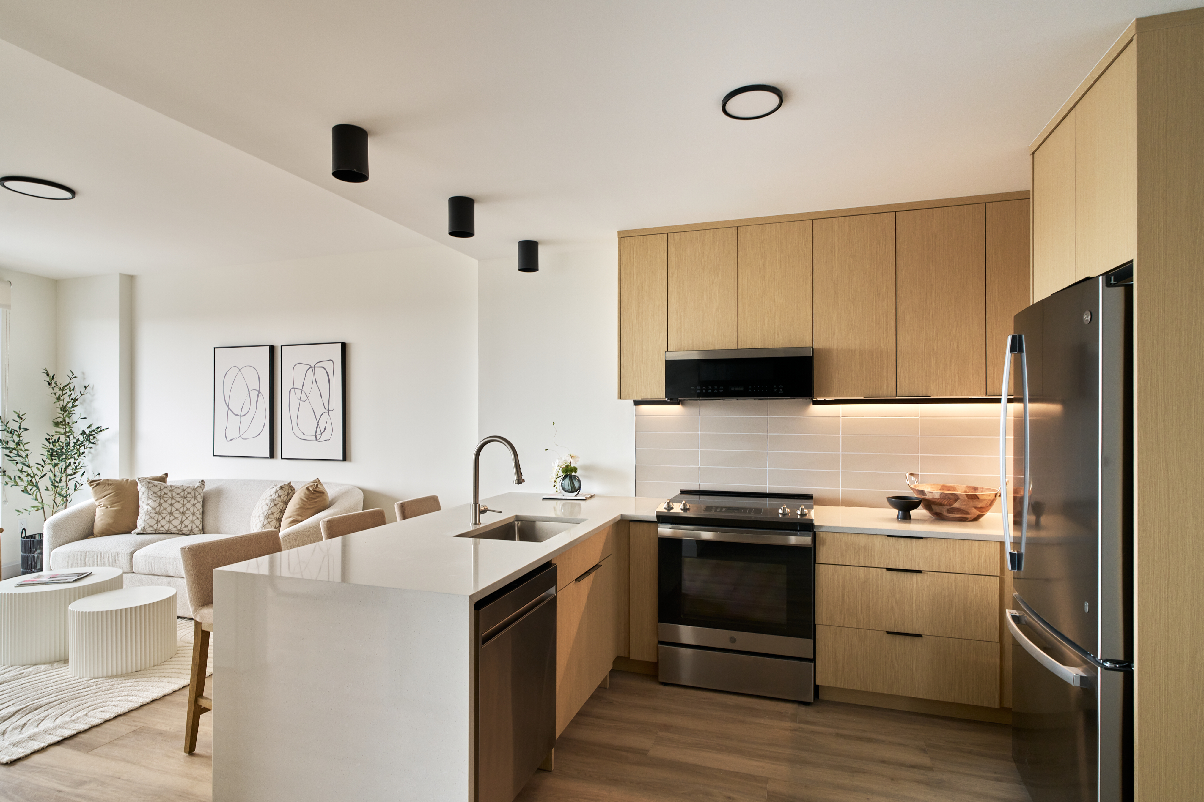 a kitchen with a sink appliances and cabinets