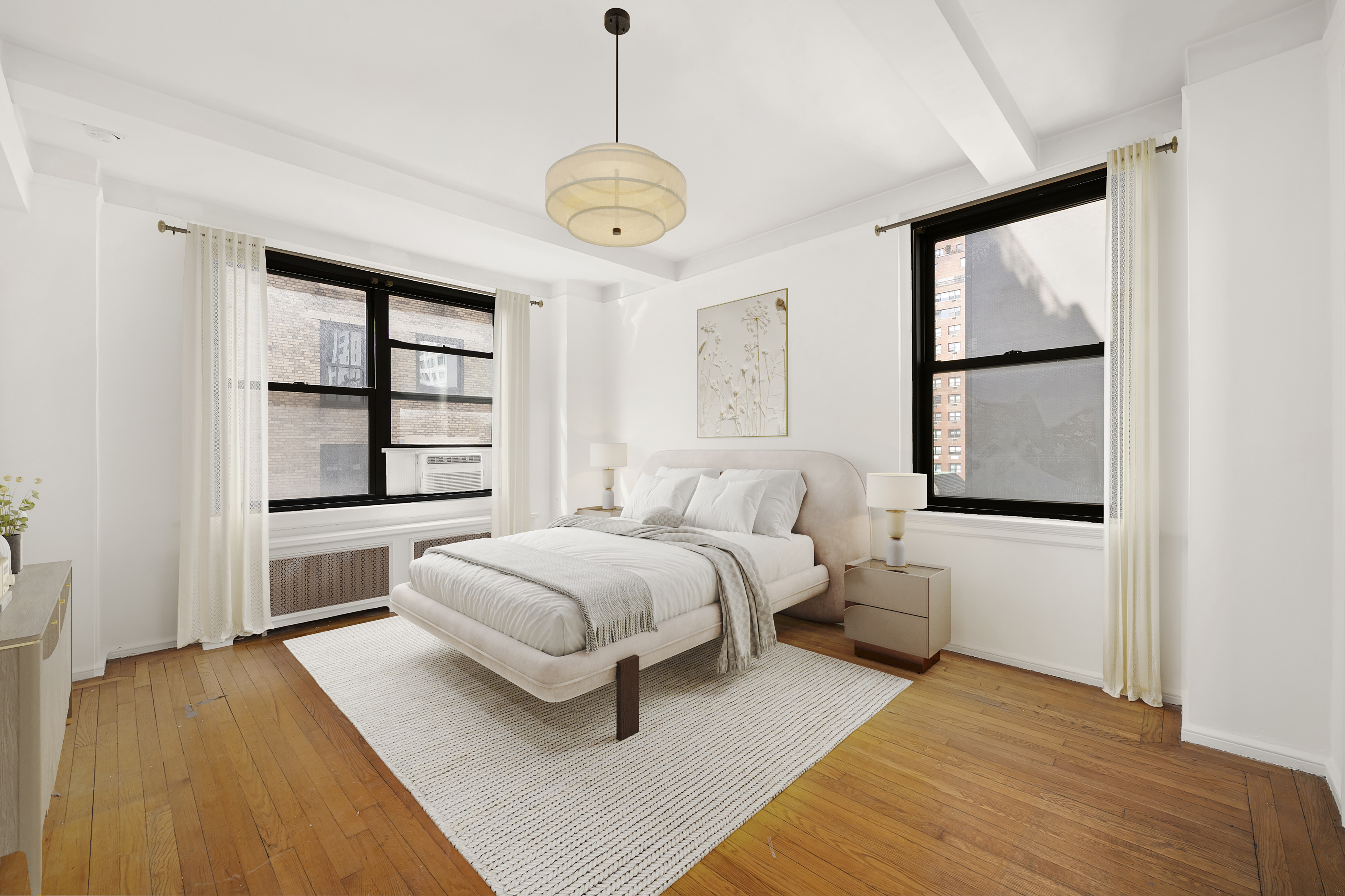 210 East 73rd Street, Unit 9EF Manhattan, NY 10021 - Photo 9 of 16 a spacious bedroom with a bed and a window