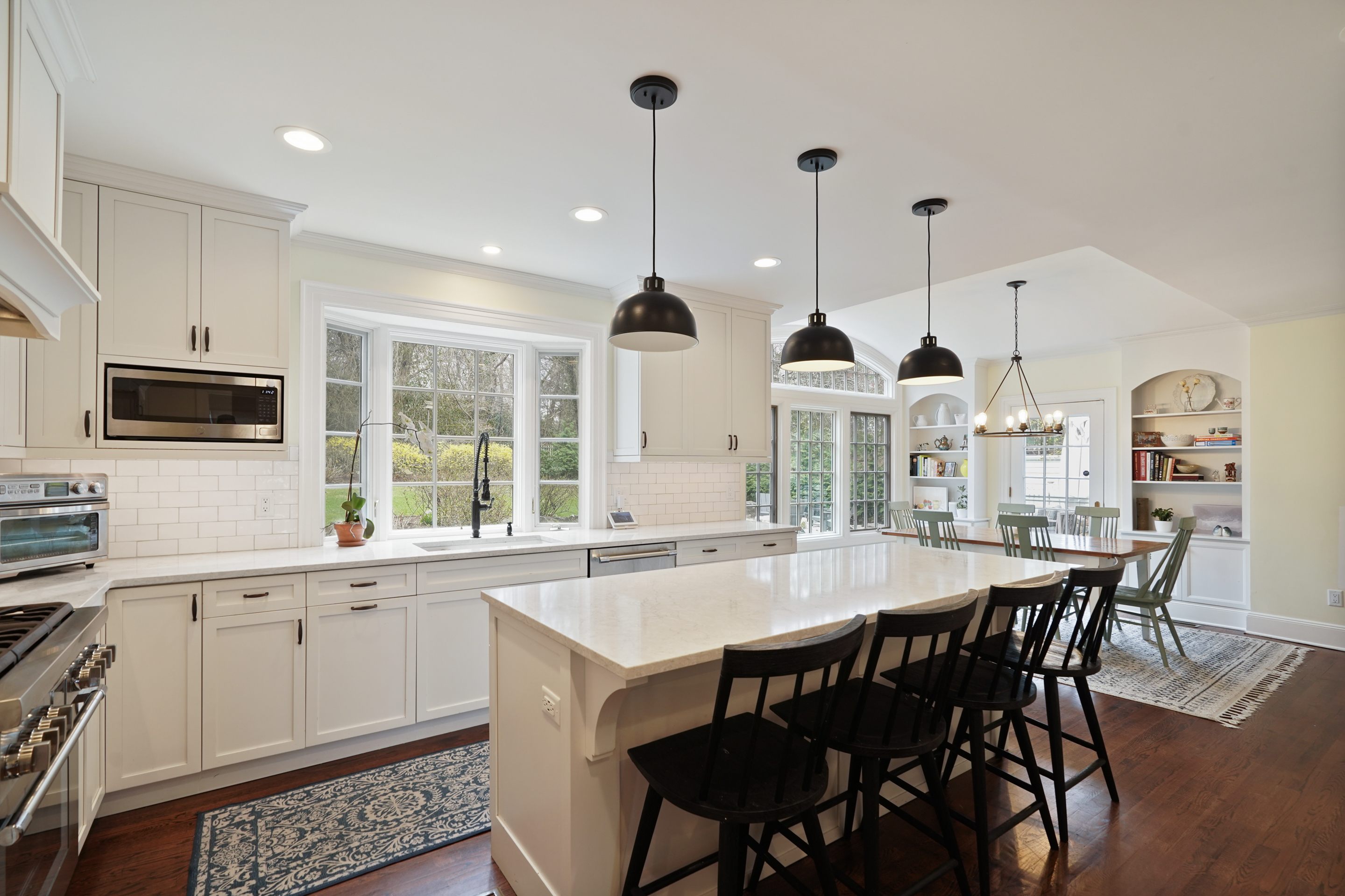 15 Anderson Road Greenwich, CT 06830 - Photo 8 of 30 a kitchen with stainless steel appliances granite countertop a kitchen island a stove a table and chairs