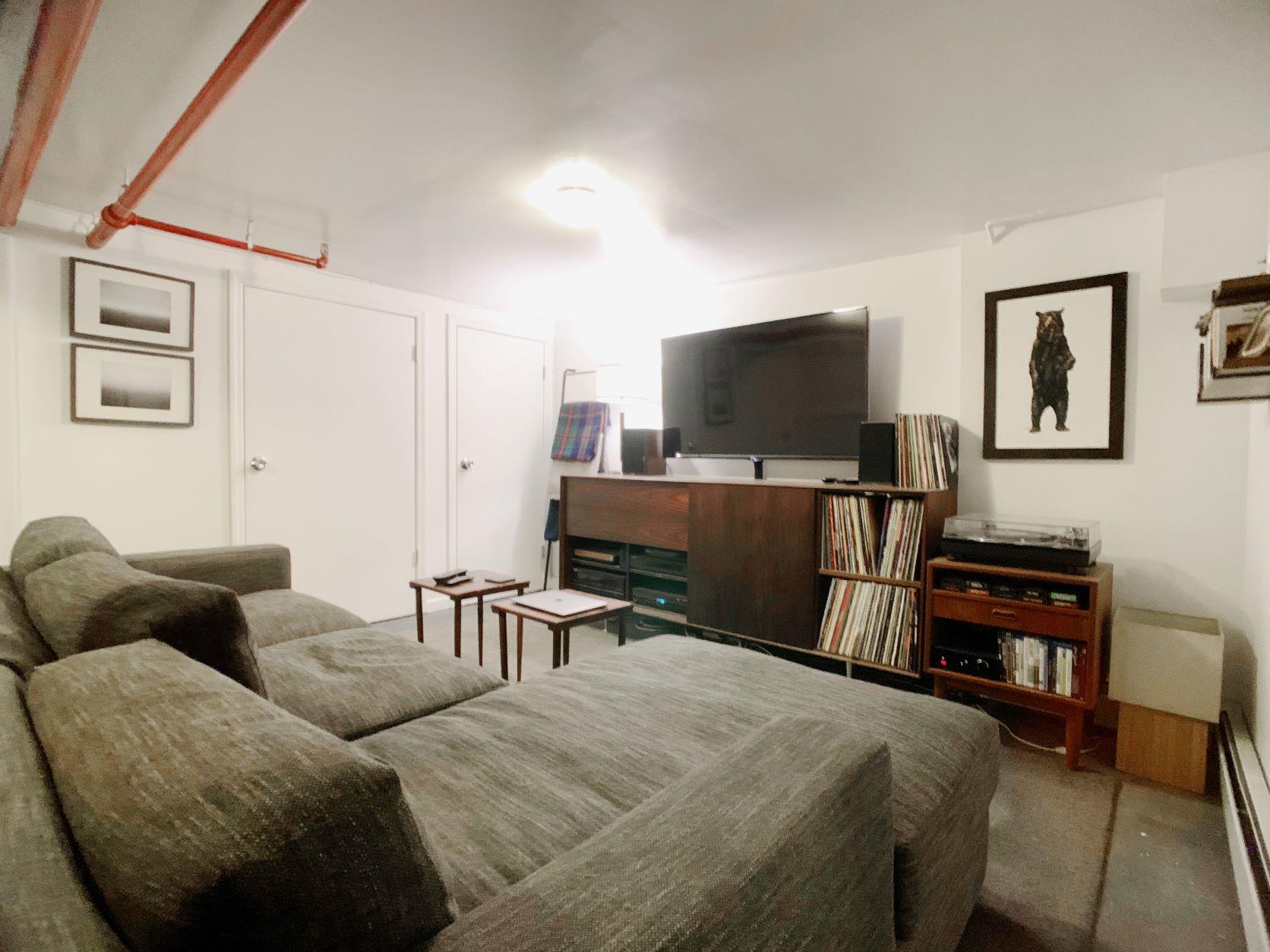 155 A 9th Street, Unit 1 Brooklyn, NY 11231 - Photo 11 of 15 a bedroom with furniture and a flat screen tv
