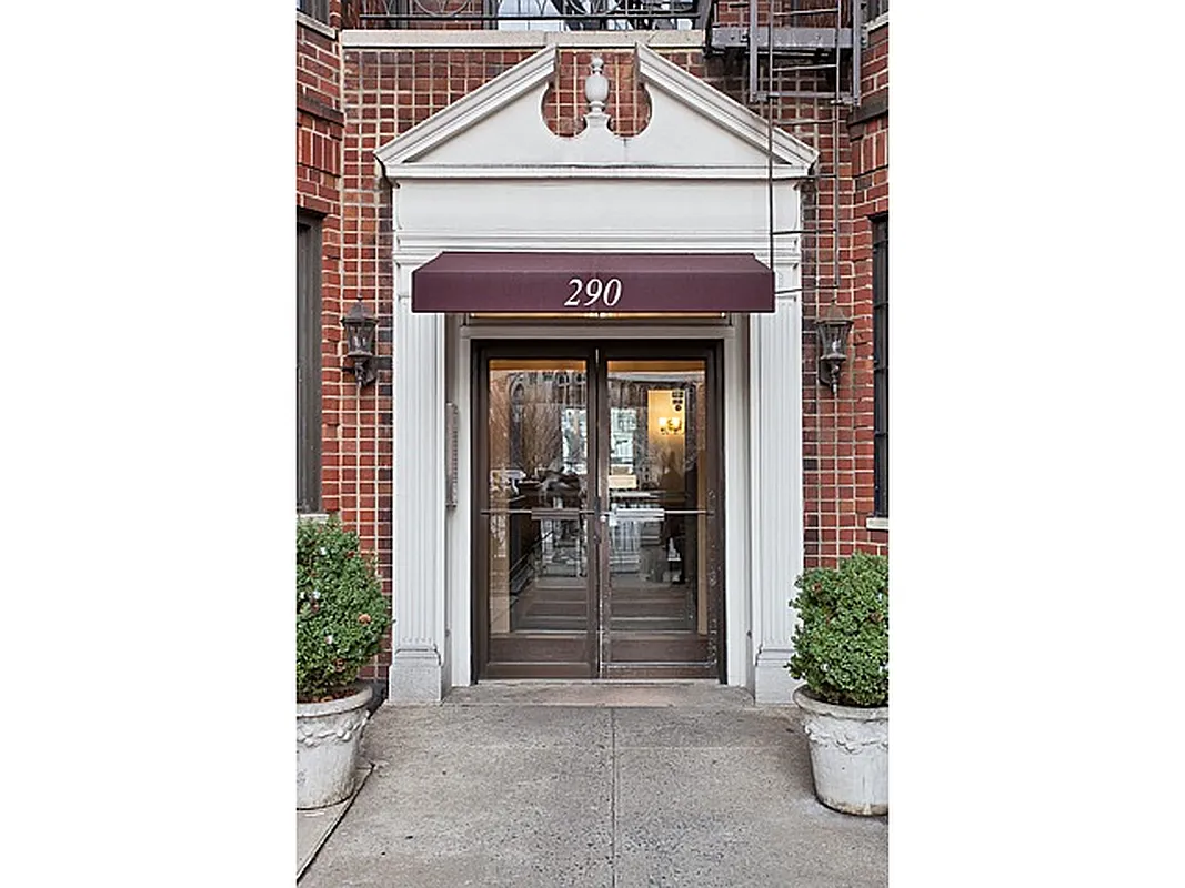 290 6th Avenue, Unit 2KL Manhattan, NY 10014 - Photo 13 of 18 a front view of a house with a yard