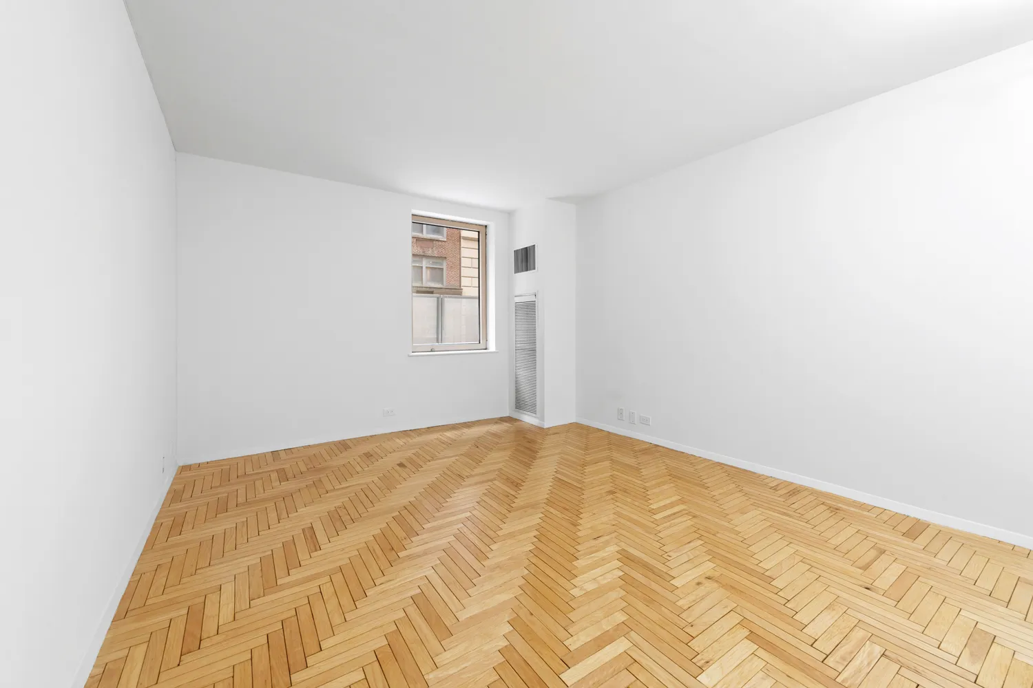 a view of a bedroom with a bed