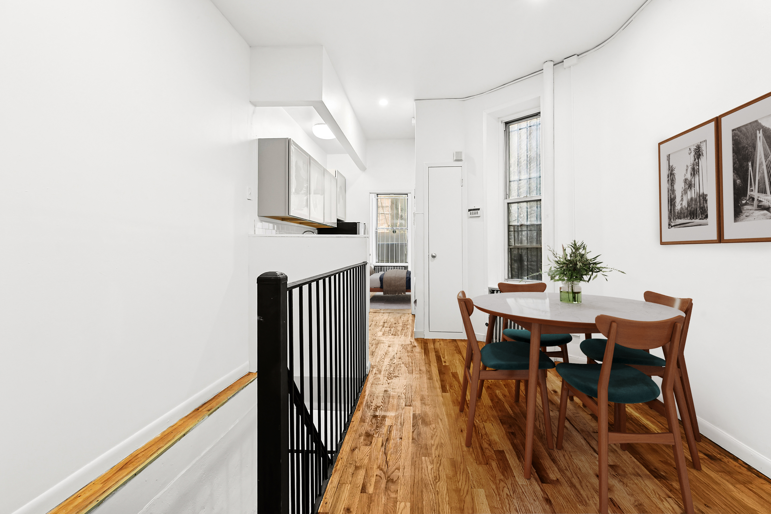 205 West 20th Street, Unit 1A Manhattan, NY 10011 - Photo 2 of 7 a view of a dining room with furniture and wooden floor