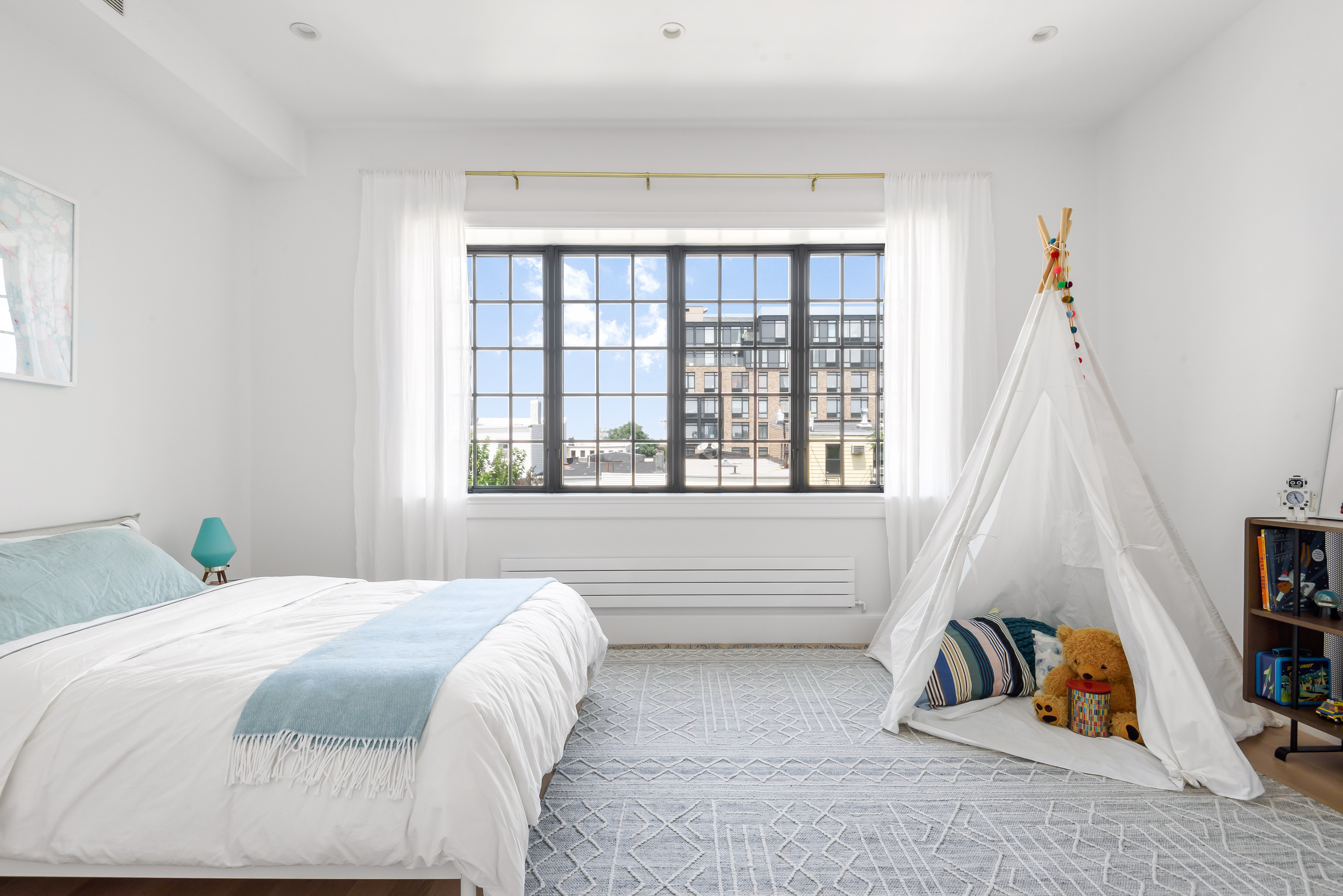 179 Devoe Street, Unit 2 Brooklyn, NY 11211 - Photo 8 of 19 a bedroom with a bed and a window