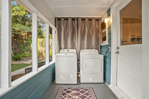 a utility room with dryer and washer