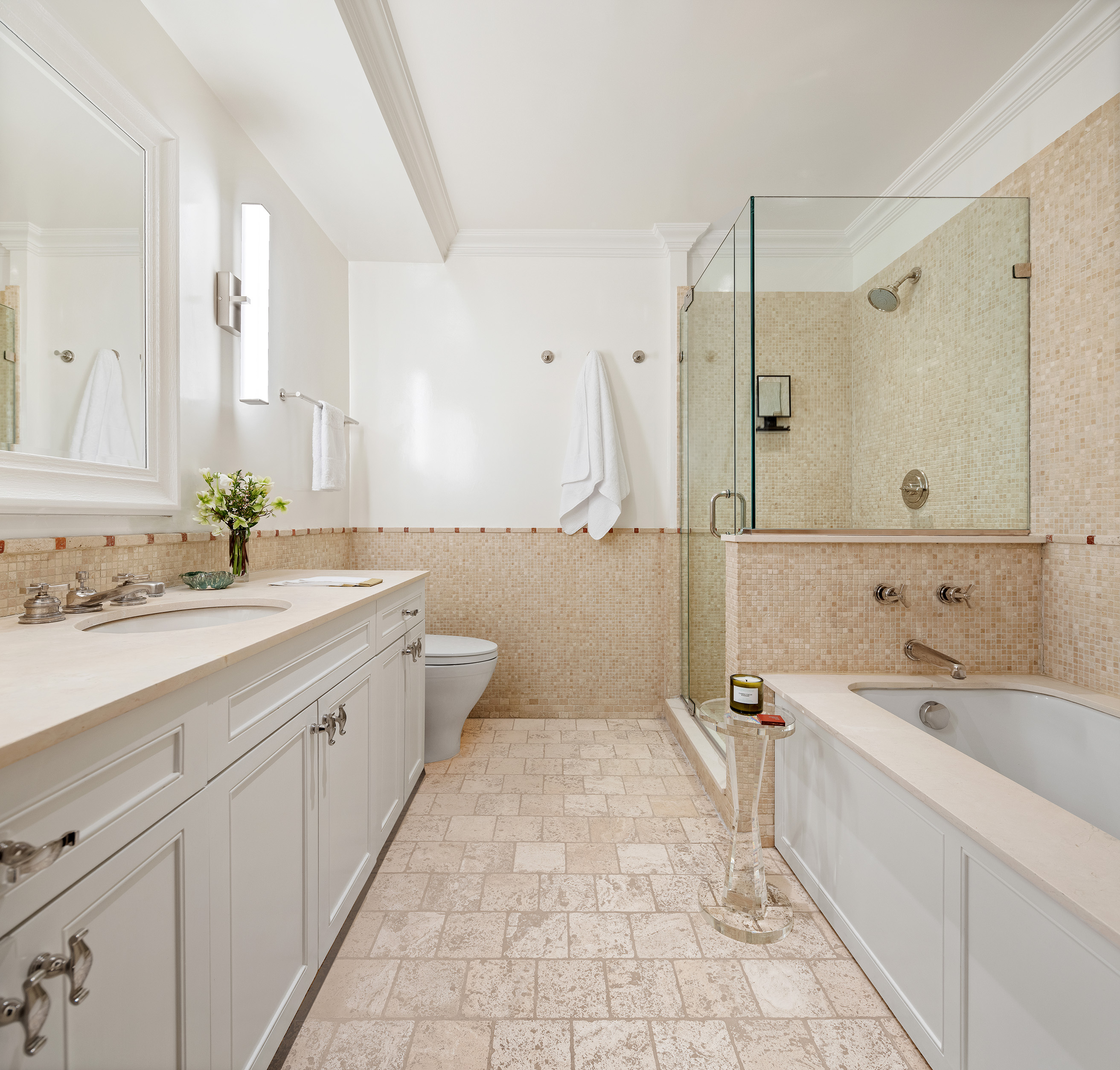 72 Perry Street, Unit GARDEN Manhattan, NY 10014 - Photo 7 of 15 a spacious bathroom with a double vanity sink mirror double and bathtub