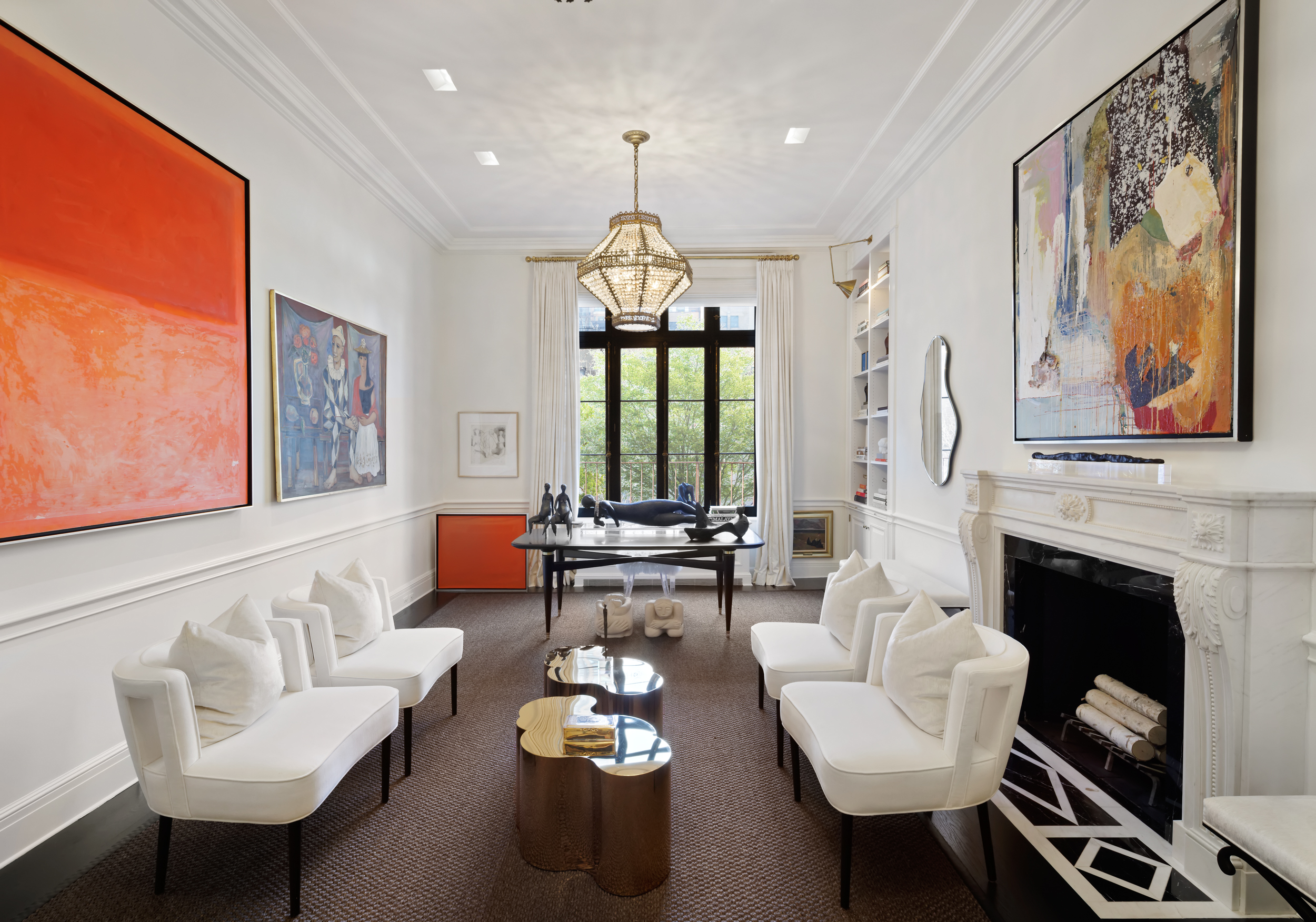 170 East 78th Street, Unit 8E Manhattan, NY 10075 - Photo 3 of 16 a living room with furniture fireplace and a large window