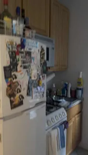 a kitchen with a stove and cabinets