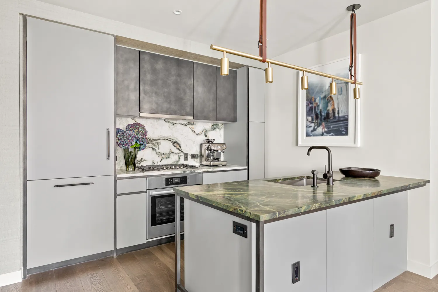 a kitchen with stainless steel appliances granite countertop a sink and a refrigerator