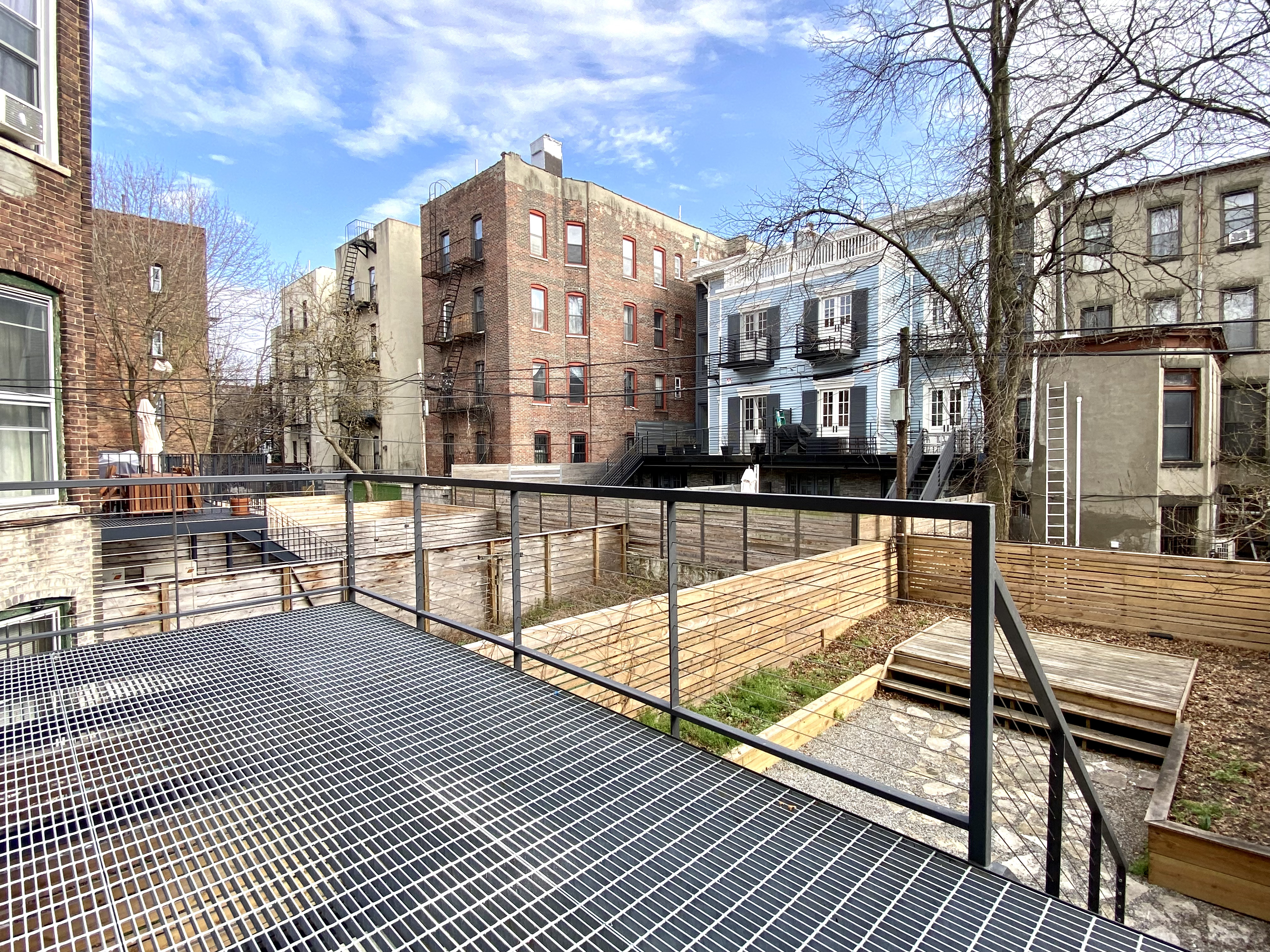 1420 Pacific Street, Unit 1 Brooklyn, NY 11216 - Photo 7 of 30 a view of a balcony with chairs and wooden floor