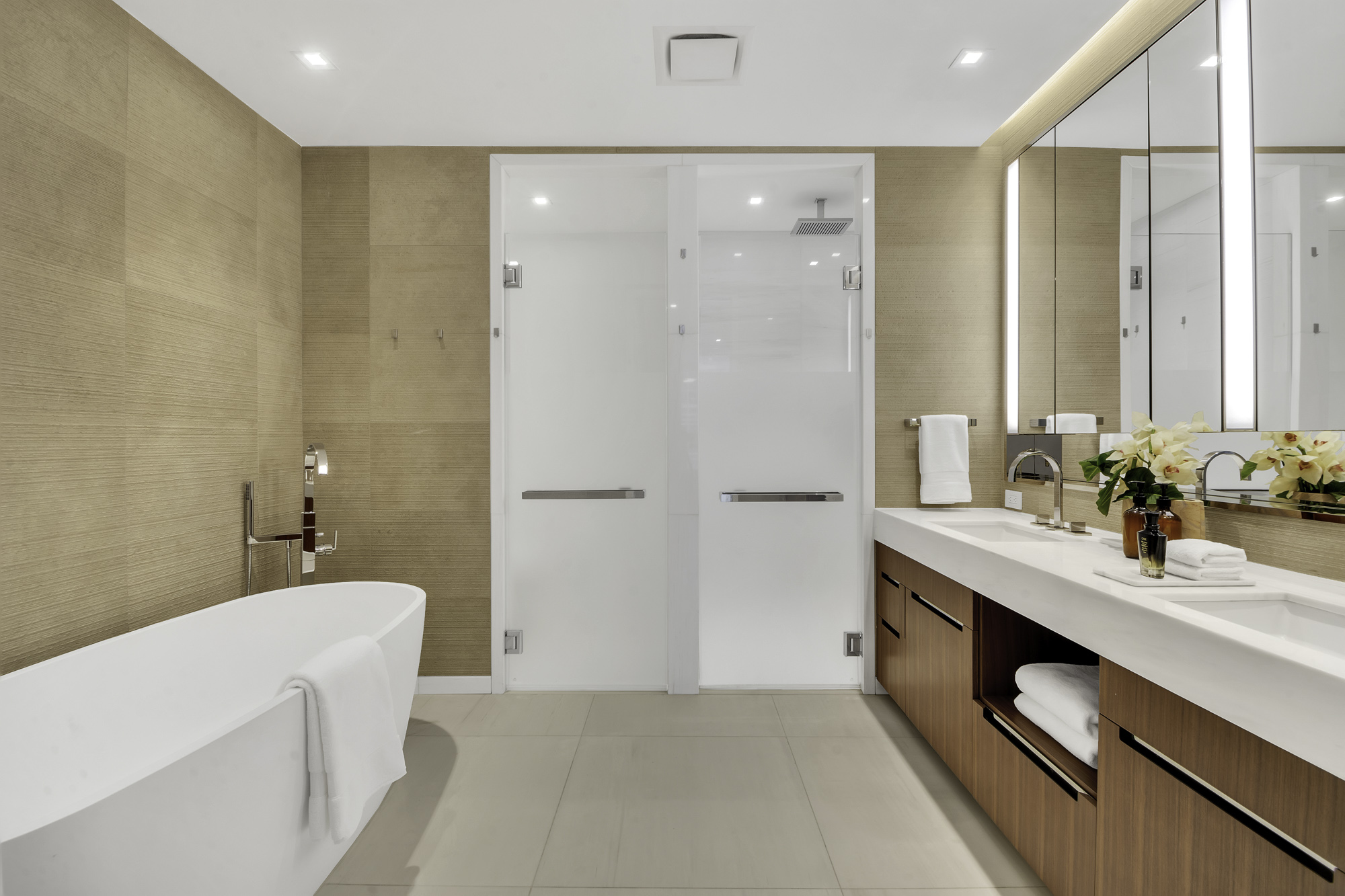 1 West End Avenue, Unit 10A Manhattan, NY 10023 - Photo 15 of 38 a bathroom with a tub sink and mirror