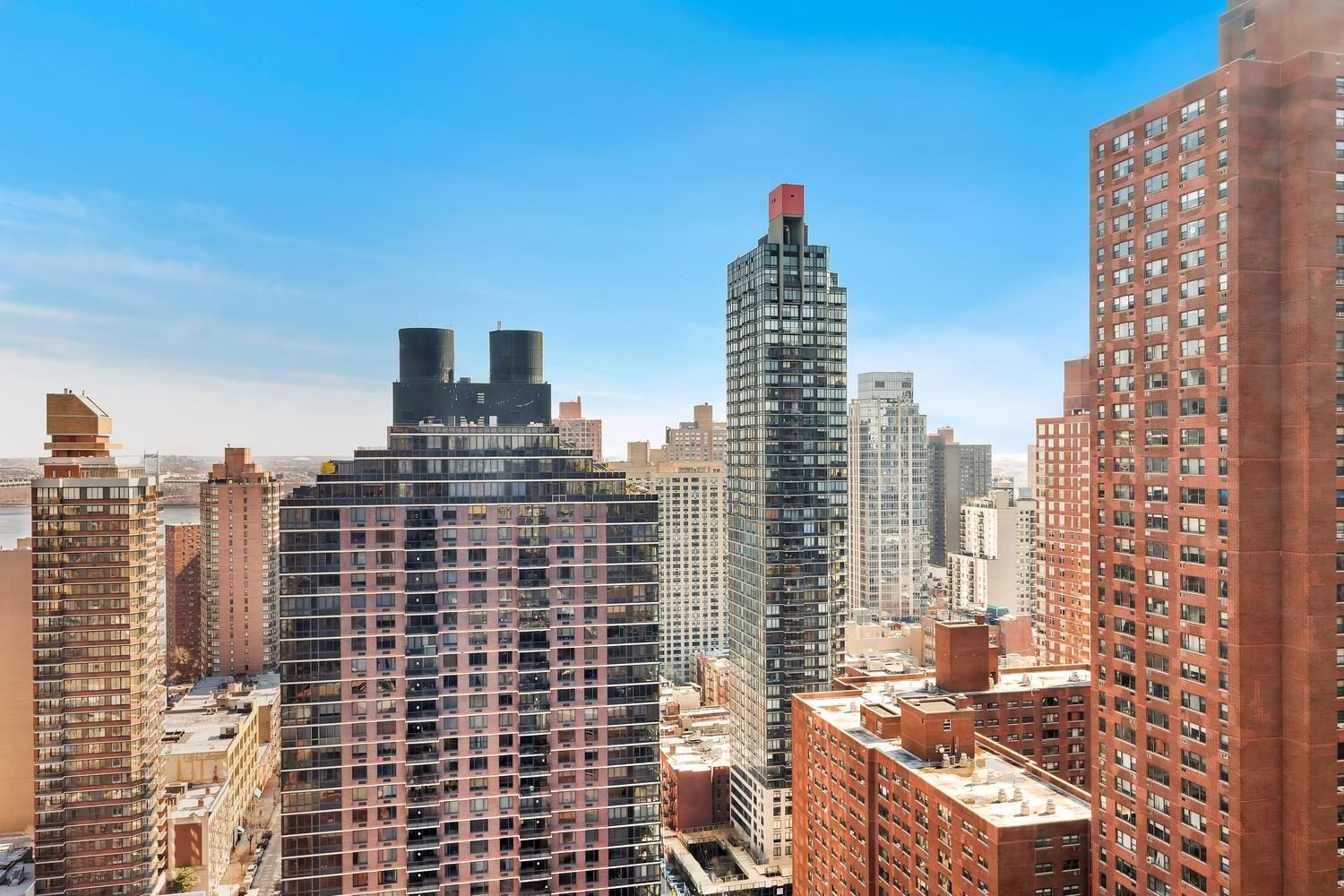 200 East 94th Street, Unit 2911 Manhattan, NY 10128 - Photo 8 of 20 a view of a city with tall buildings
