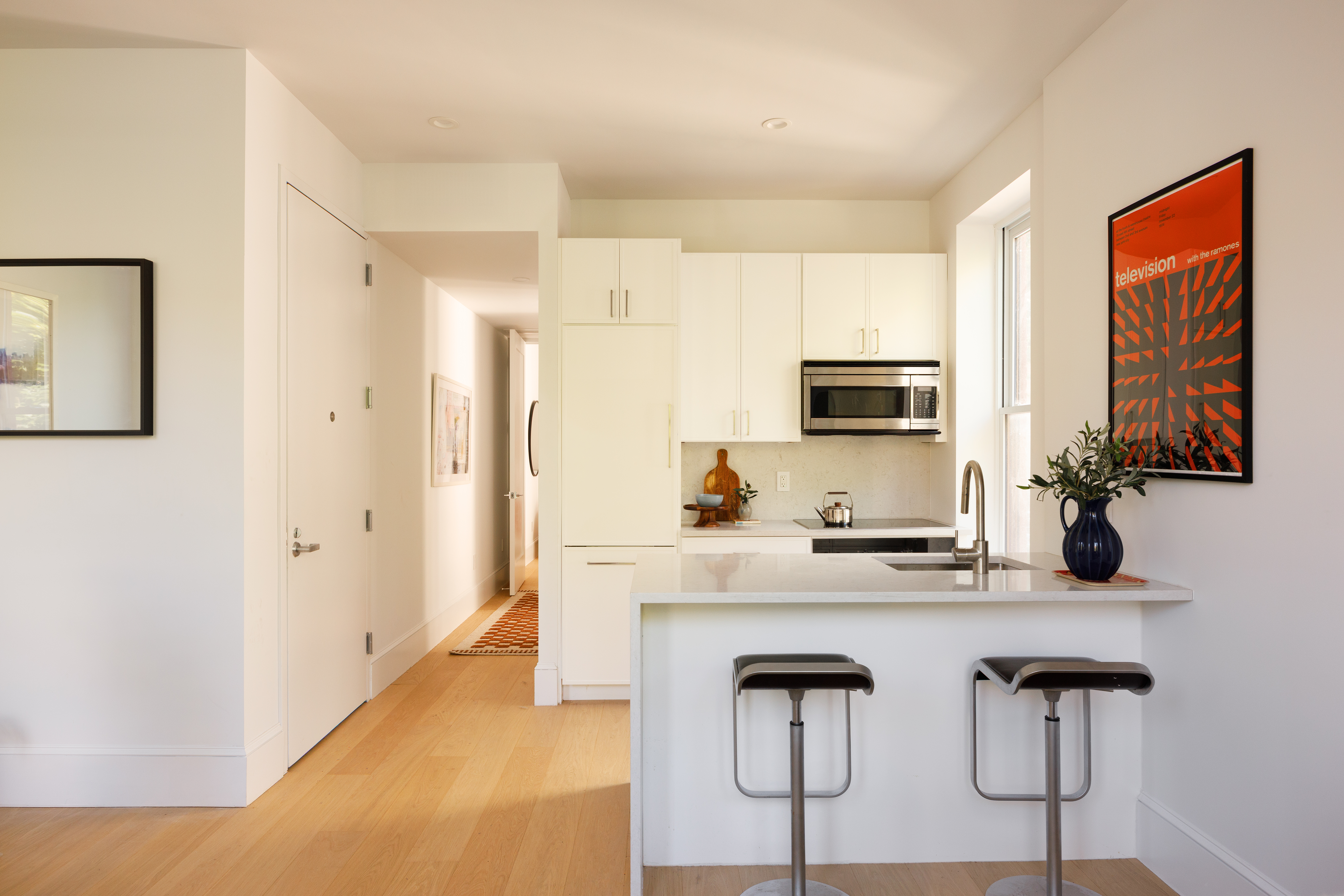 1370 Dean Street, Unit C Brooklyn, NY 11216 - Photo 2 of 7 a kitchen with stainless steel appliances a sink and a refrigerator
