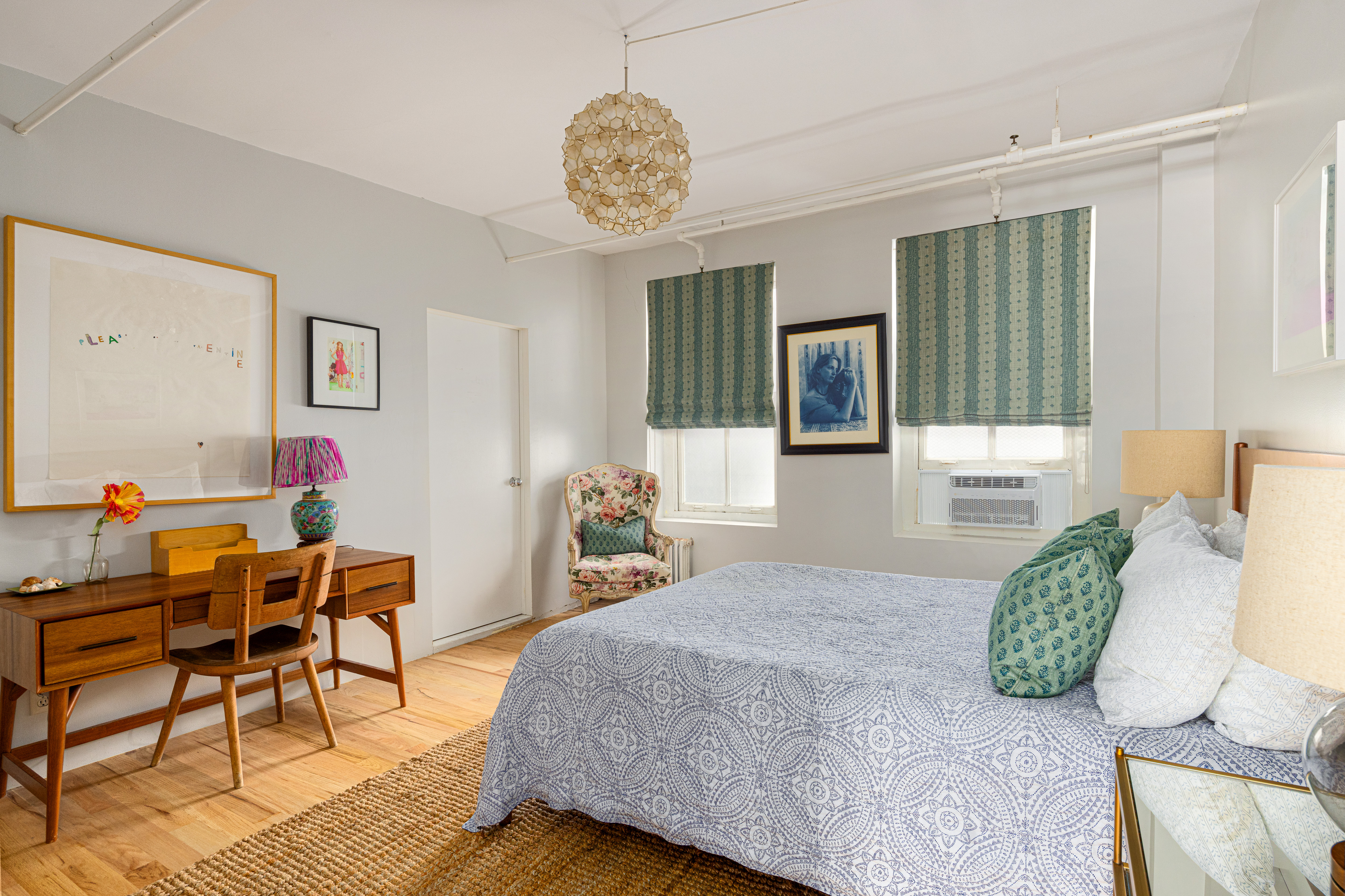 191 Chrystie Street, Unit 5R Manhattan, NY 10002 - Photo 9 of 16 a bedroom with furniture and a large window