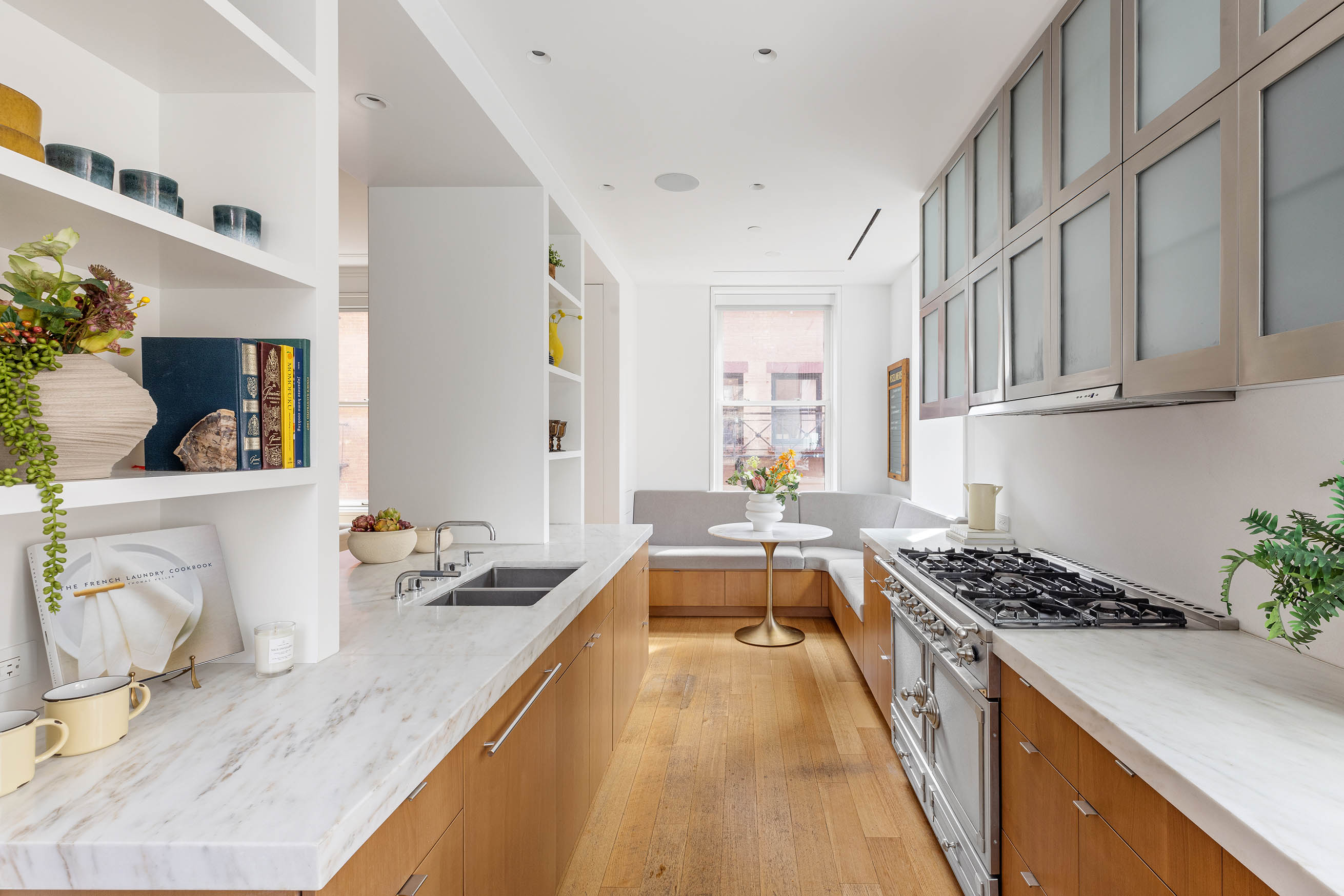 7 Harrison Street, Unit 5S Manhattan, NY 10013 - Photo 10 of 21 a kitchen with stainless steel appliances granite countertop a sink stove and cabinets