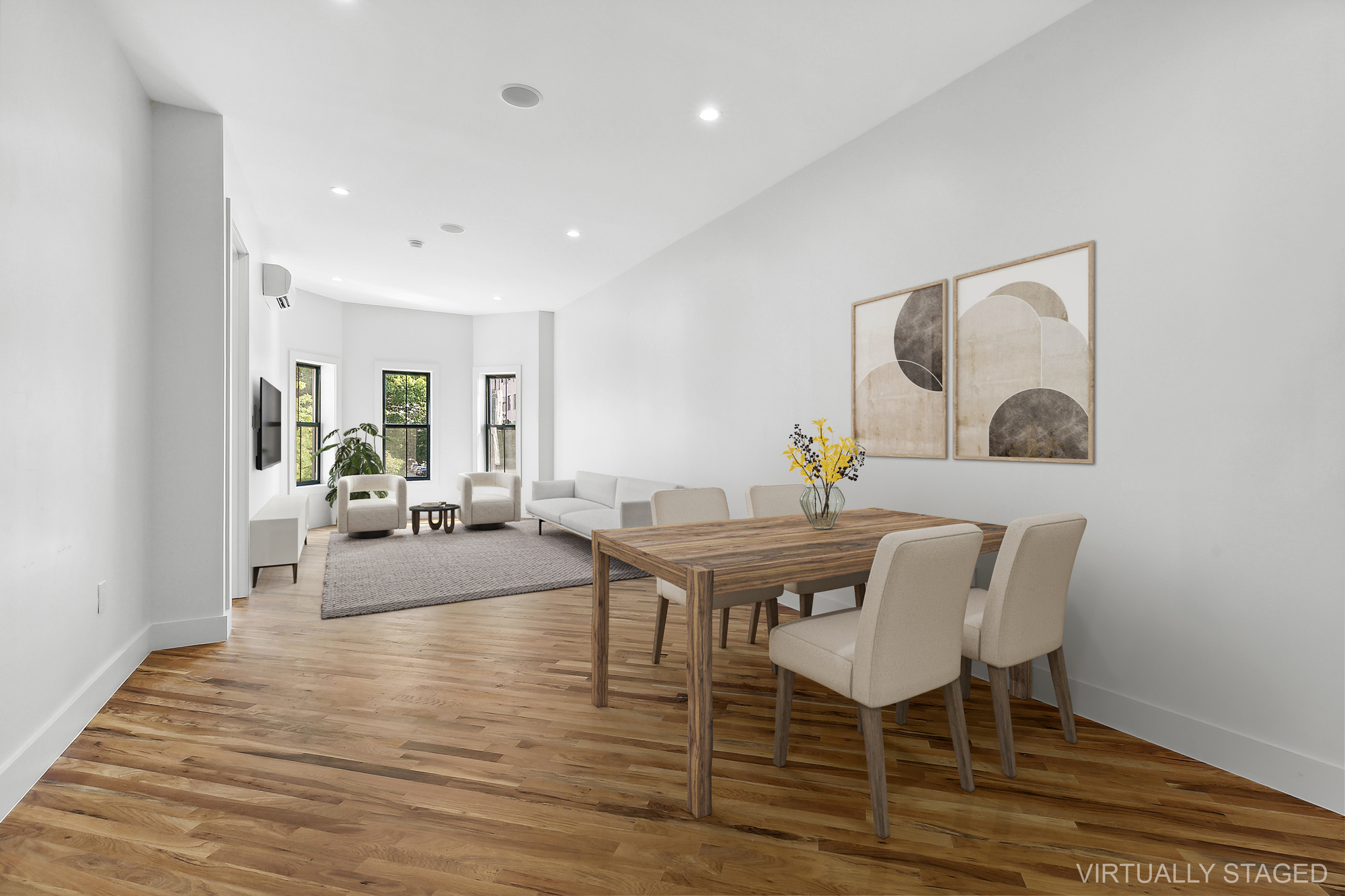 a view of a dining room with furniture window and wooden floor