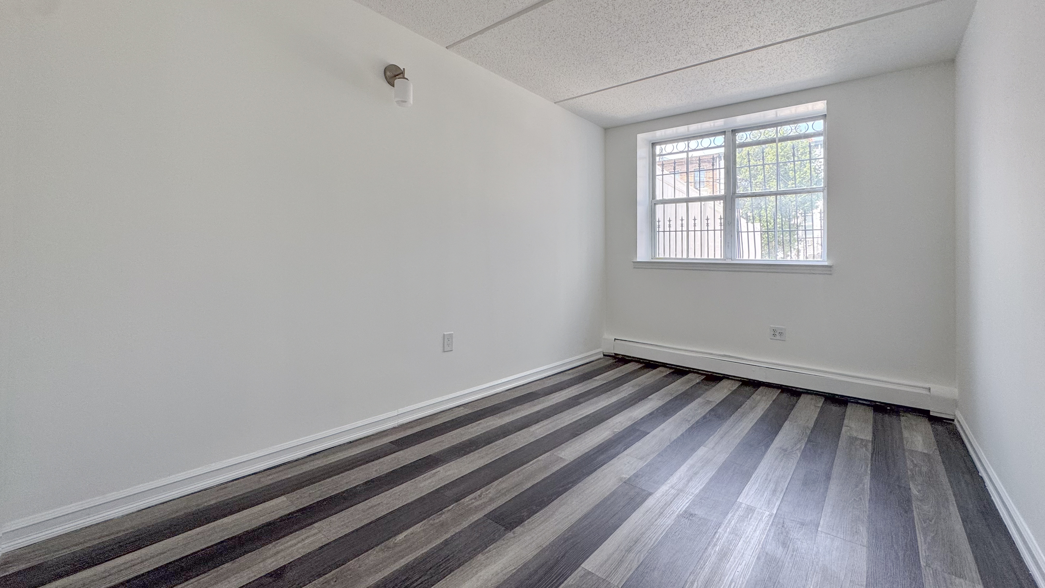 175 Eldert Street, Unit 1 Brooklyn, NY 11207 - Photo 4 of 12 wooden floor in an empty room
