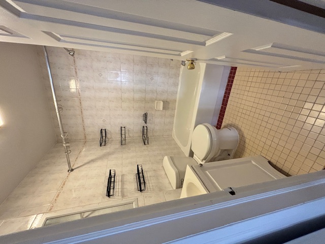 138 East 34th Street, Unit 3F Manhattan, NY 10016 - Photo 6 of 6 a bathroom with a toilet and a shower