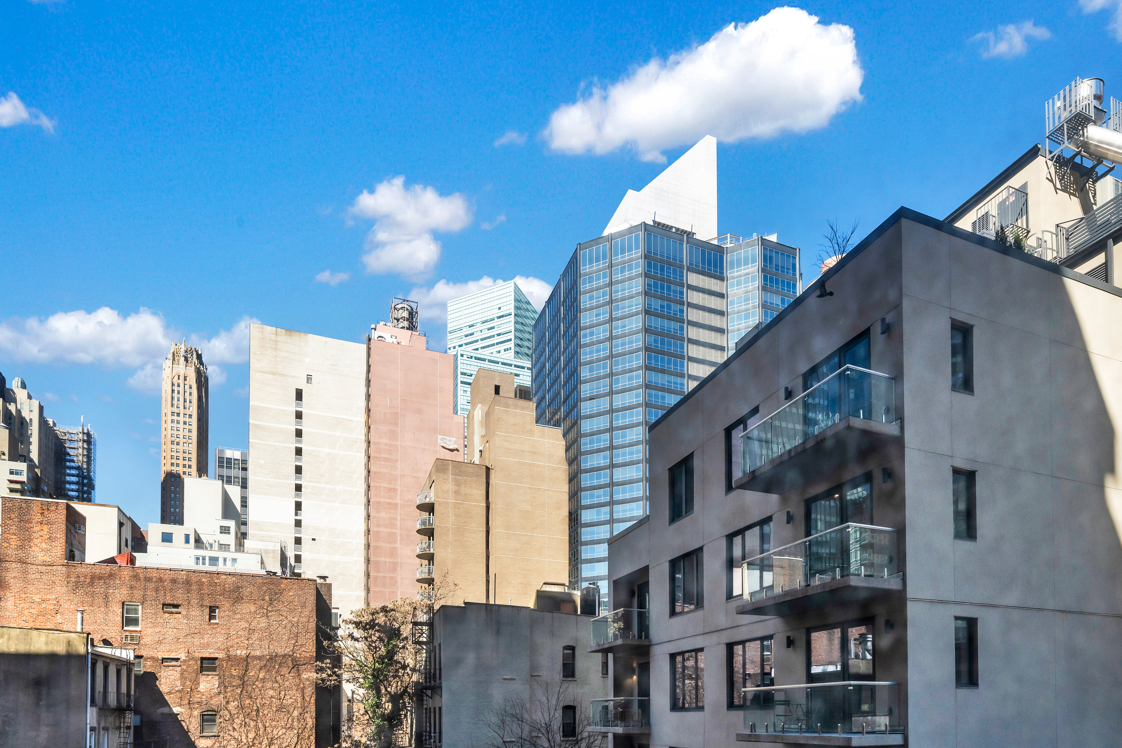 251 East 51st Street, Unit 5B Manhattan, NY 10022 - Photo 3 of 8 a view of a city with tall buildings