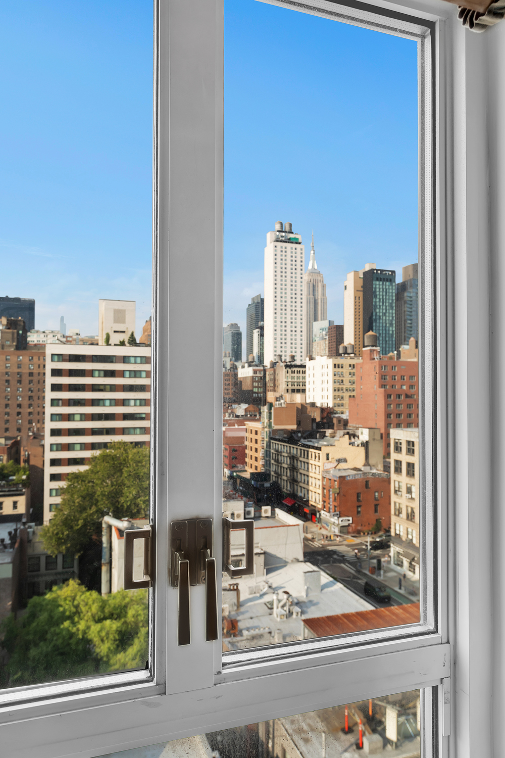 200 West 20th Street, Unit 1110 Manhattan, NY 10011 - Photo 4 of 10 a view of a city with tall buildings