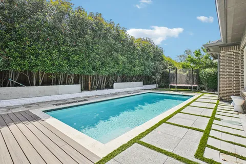 a view of a backyard with sitting area
