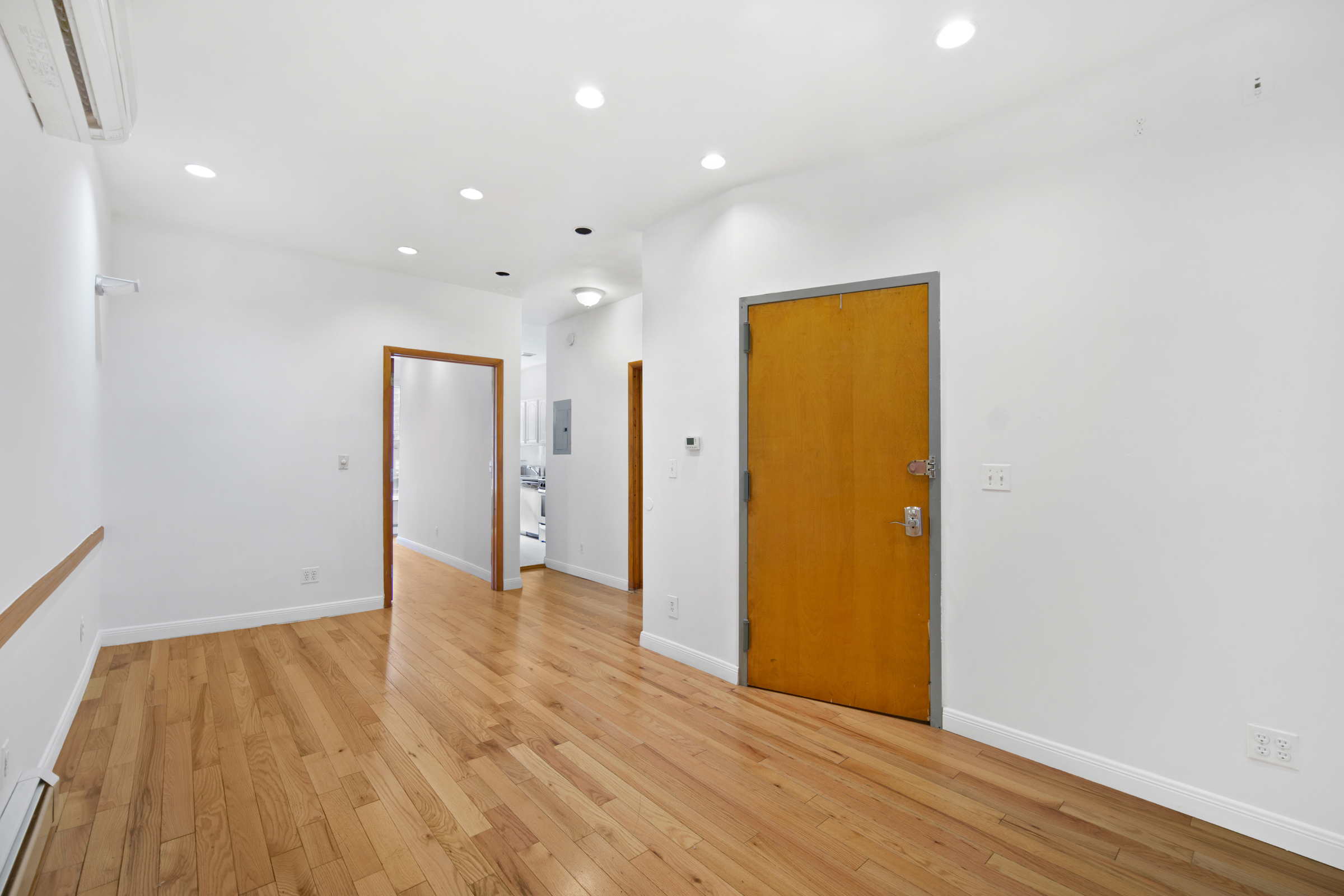614 Eastern Parkway, Unit 2 Brooklyn, NY 11225 - Photo 2 of 6 a view of an empty room with wooden floor and closet