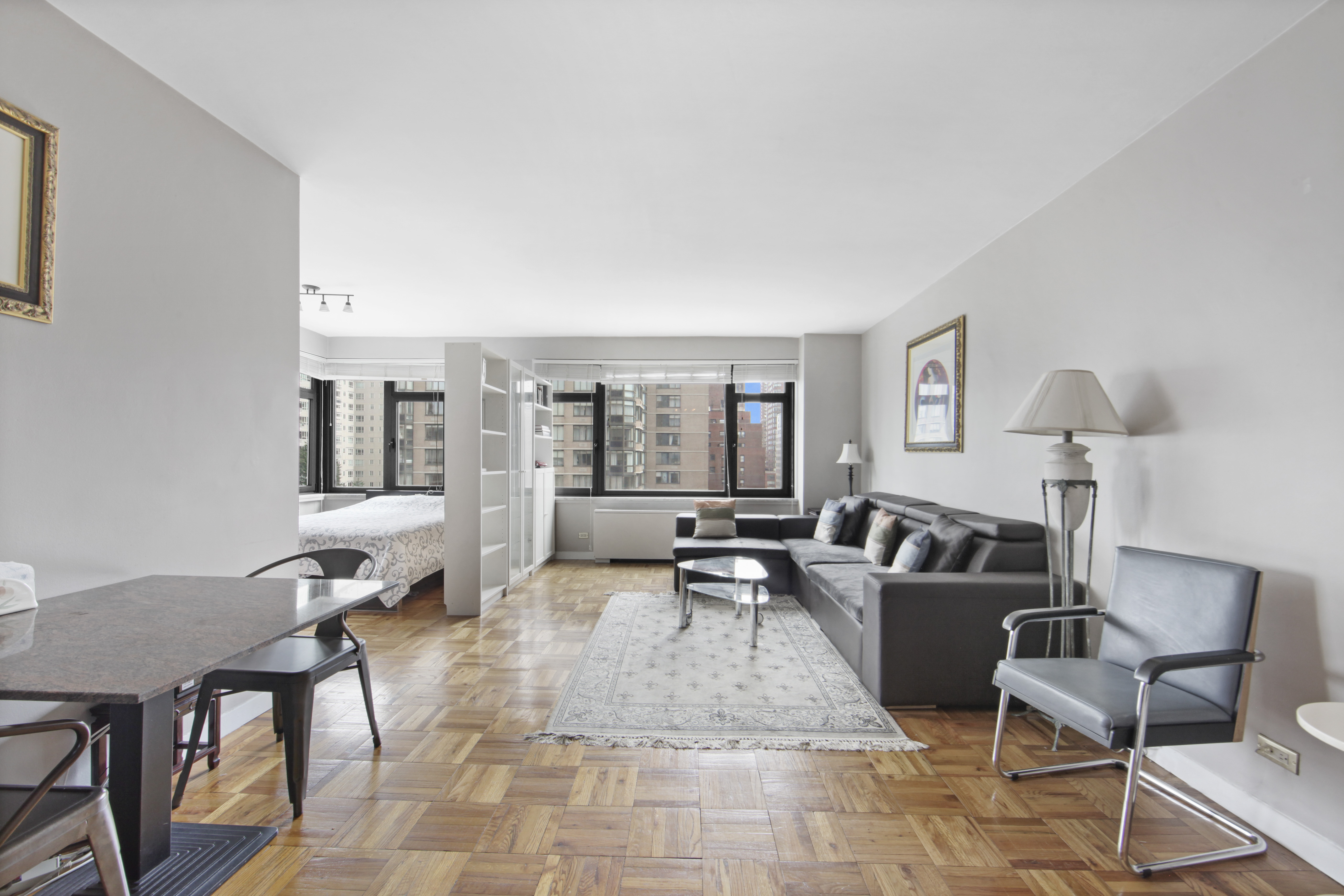 160 East 65th Street, Unit 8A Manhattan, NY 10065 - Photo 4 of 13 a living room with furniture and a table