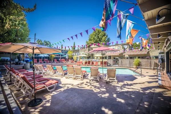 a bathroom with a sink a mirror and a toilet