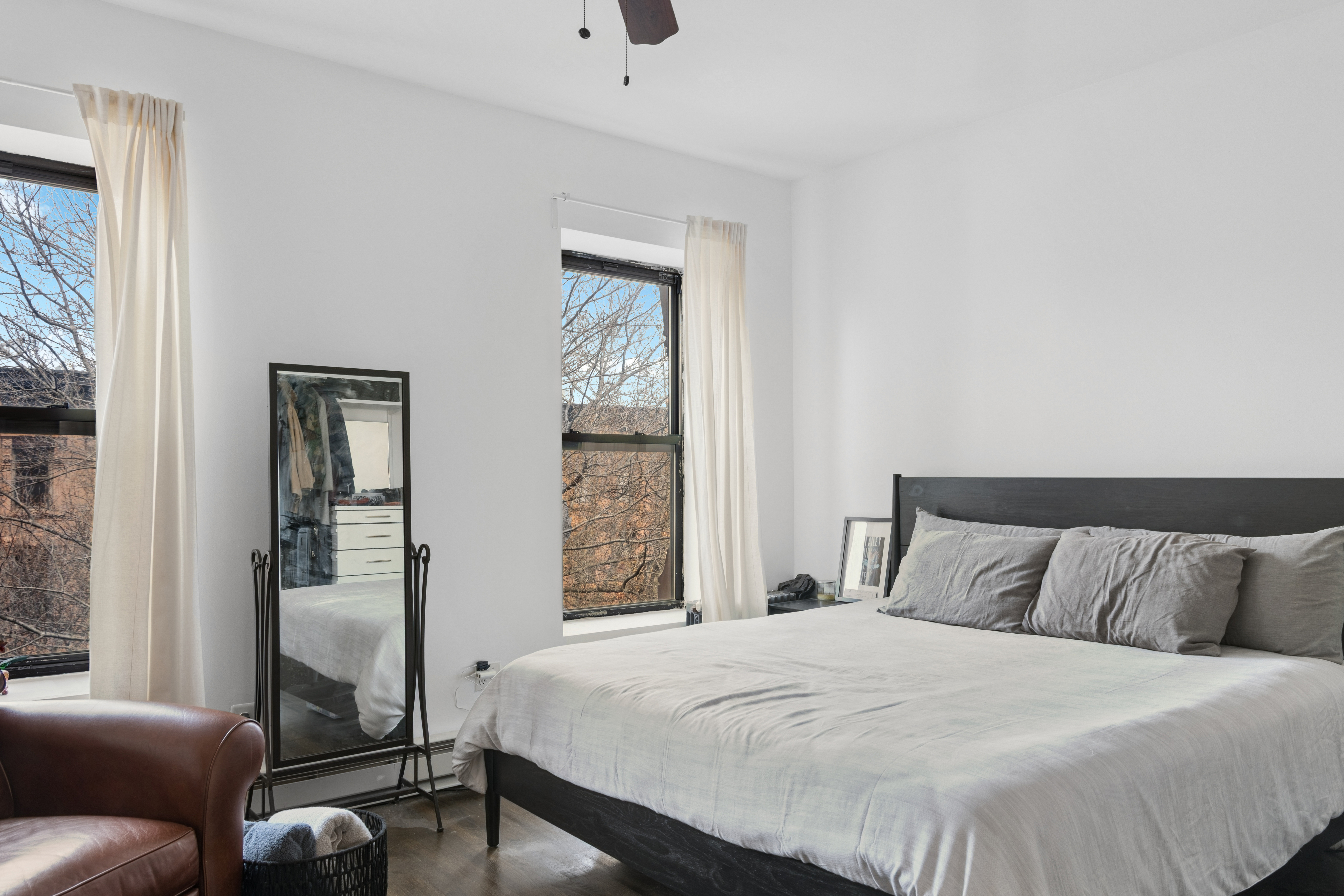 38 Halsey Street, Unit 3 Brooklyn, NY 11216 - Photo 6 of 9 a bedroom with a bed and wooden floor