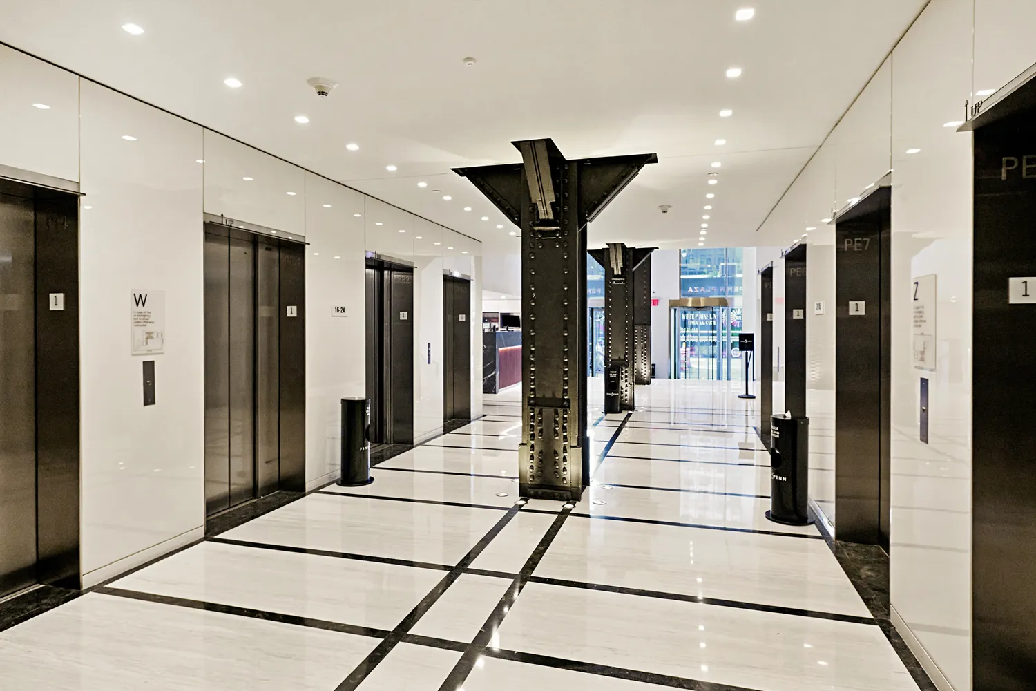 a lobby with a couch and a chandelier