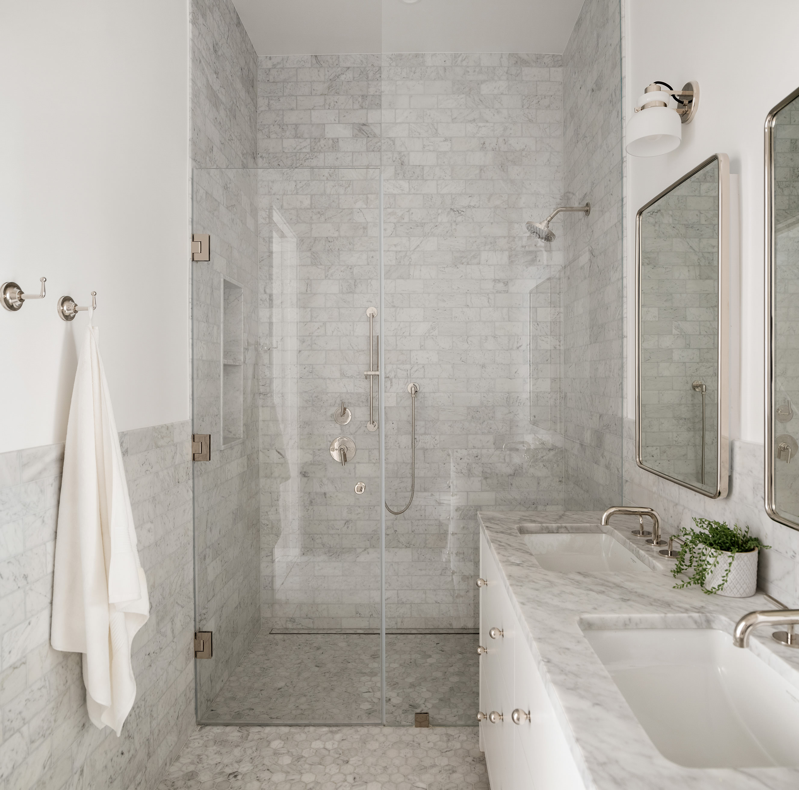 524 Halsey Street, Unit 109 Brooklyn, NY 11233 - Photo 5 of 10 a bathroom with a granite countertop sink a shower and a mirror