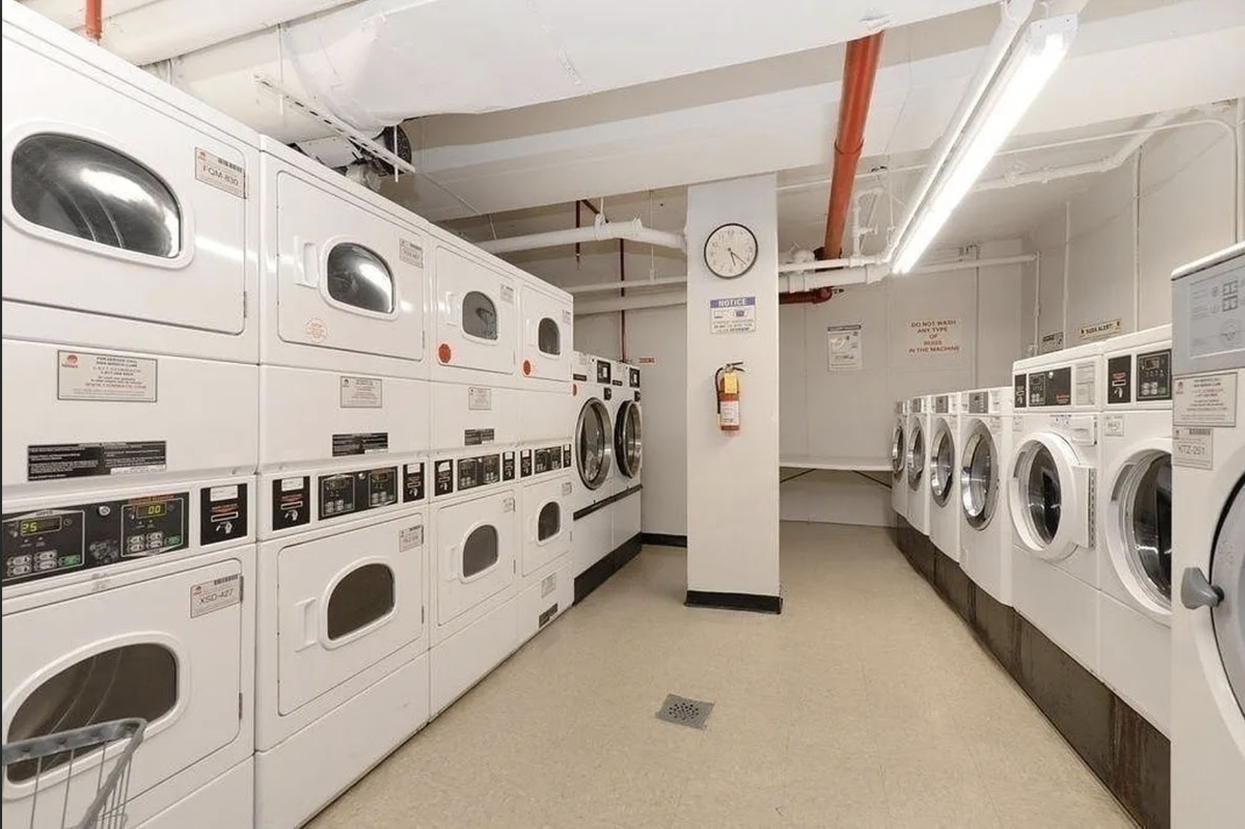 110-50 71st Road, Unit 5N Queens, NY 11375 - Photo 7 of 8 a view of a hallway with washer and dryer