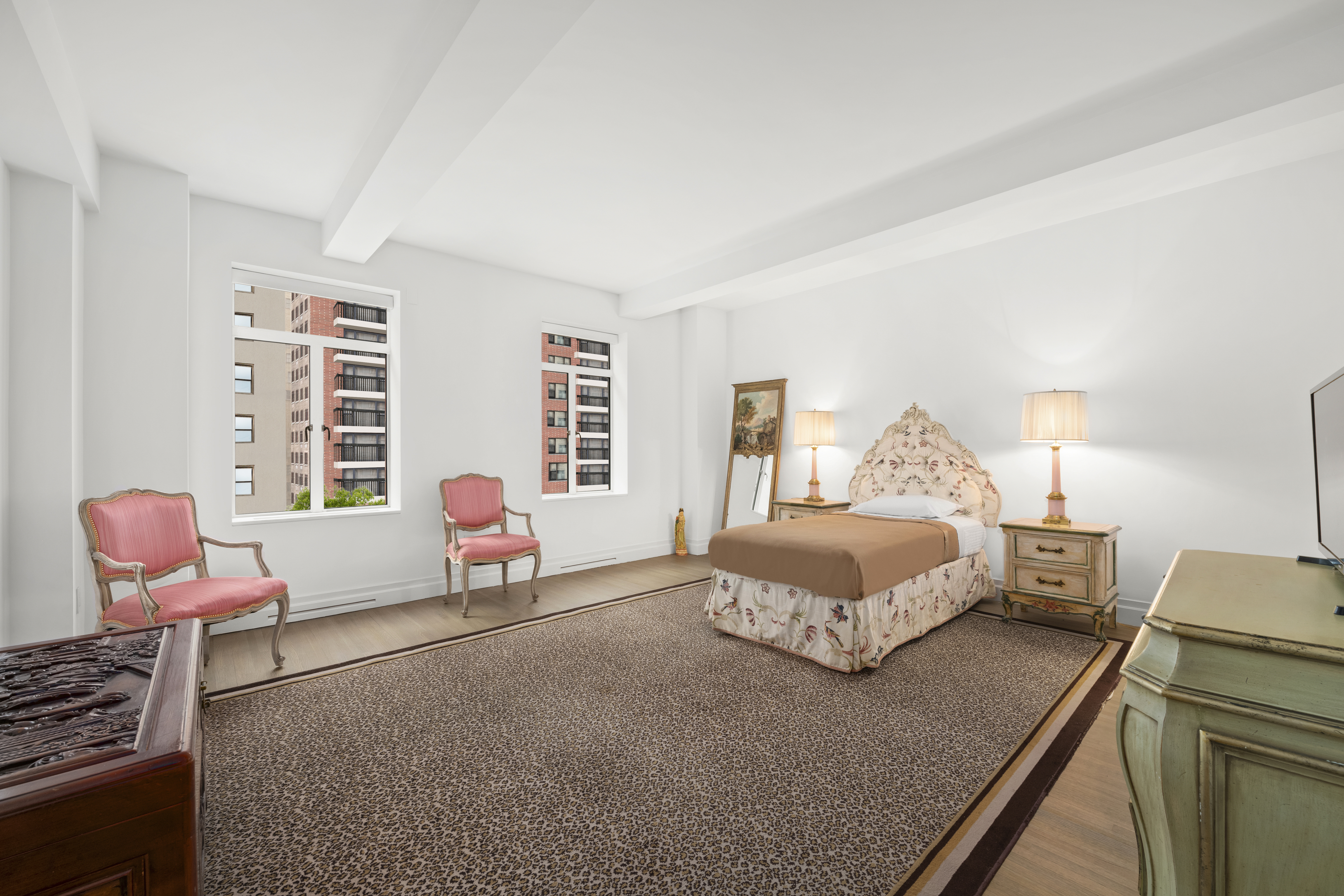 737 Park Avenue, Unit 6A Manhattan, NY 10021 - Photo 7 of 14 a bedroom with a bed and wooden floor