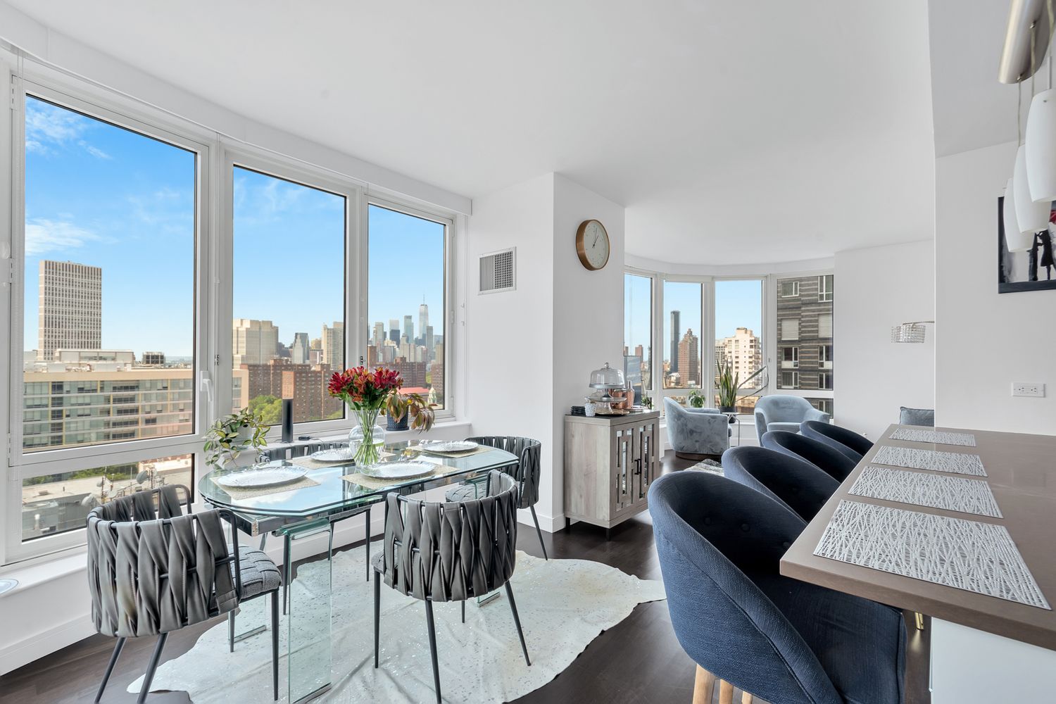 306 Gold Street, Unit 20F Brooklyn, NY 11201 - Photo 3 of 21 a view of a dining room with furniture large windows and wooden floor