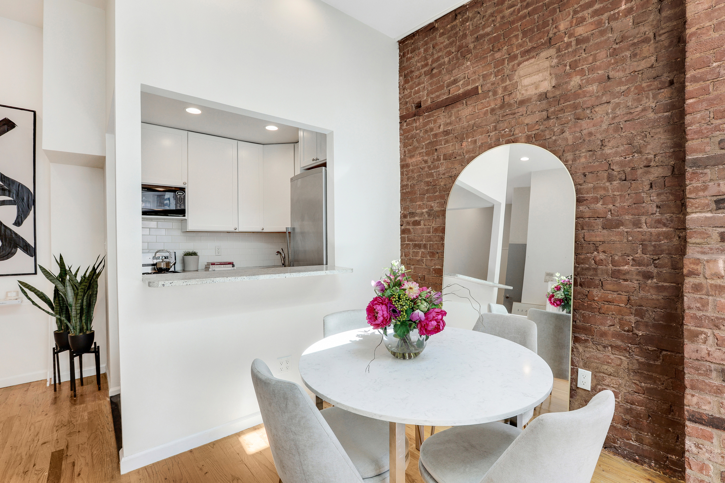 304 West 88th Street, Unit 4B Manhattan, NY 10024 - Photo 4 of 8 a dining room with furniture and a potted plant