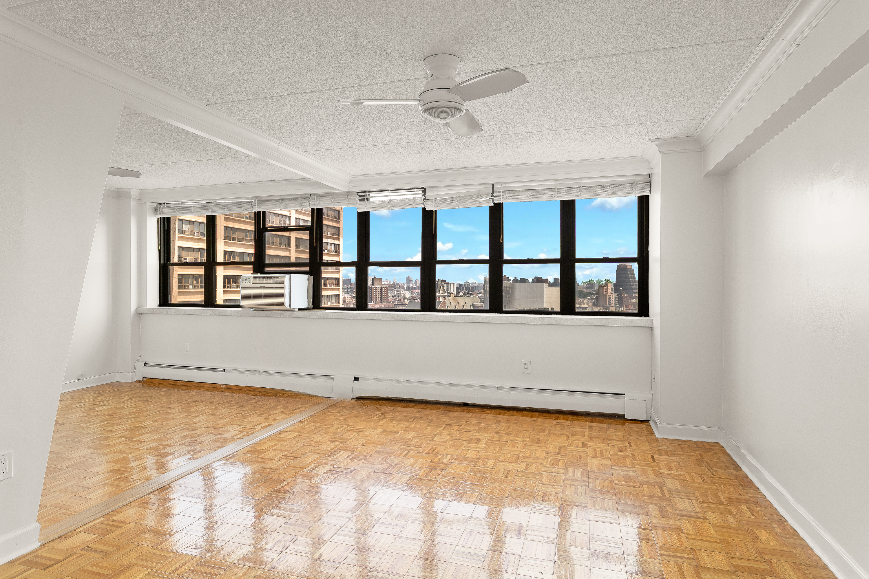 a view of an empty room with windows