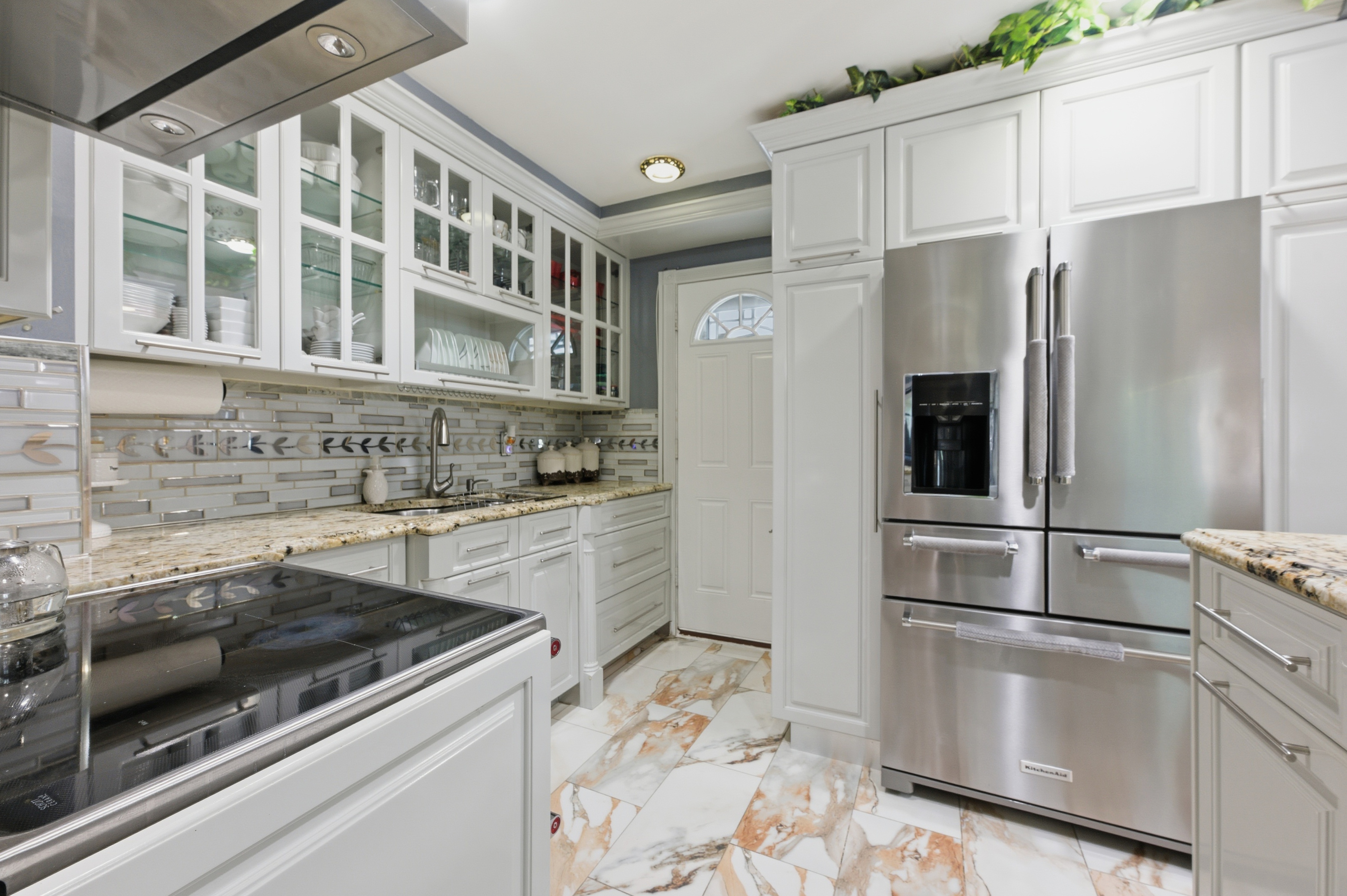 150-22 114th Road Queens, NY 11434 - Photo 3 of 22 a kitchen with stainless steel appliances granite countertop a refrigerator and a sink