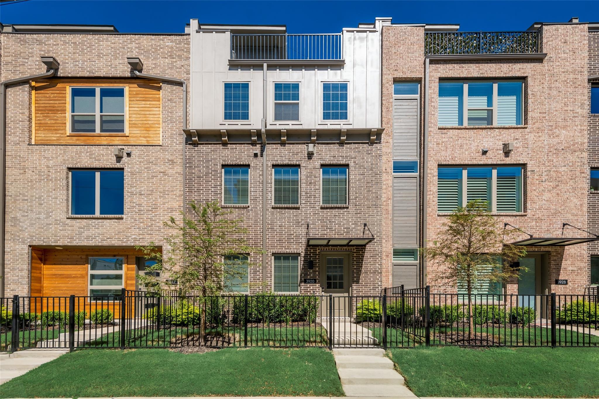 3920 Riesling Ridge Dallas, TX 75204 - Photo 23 of 26 a view of a brick building next to a yard