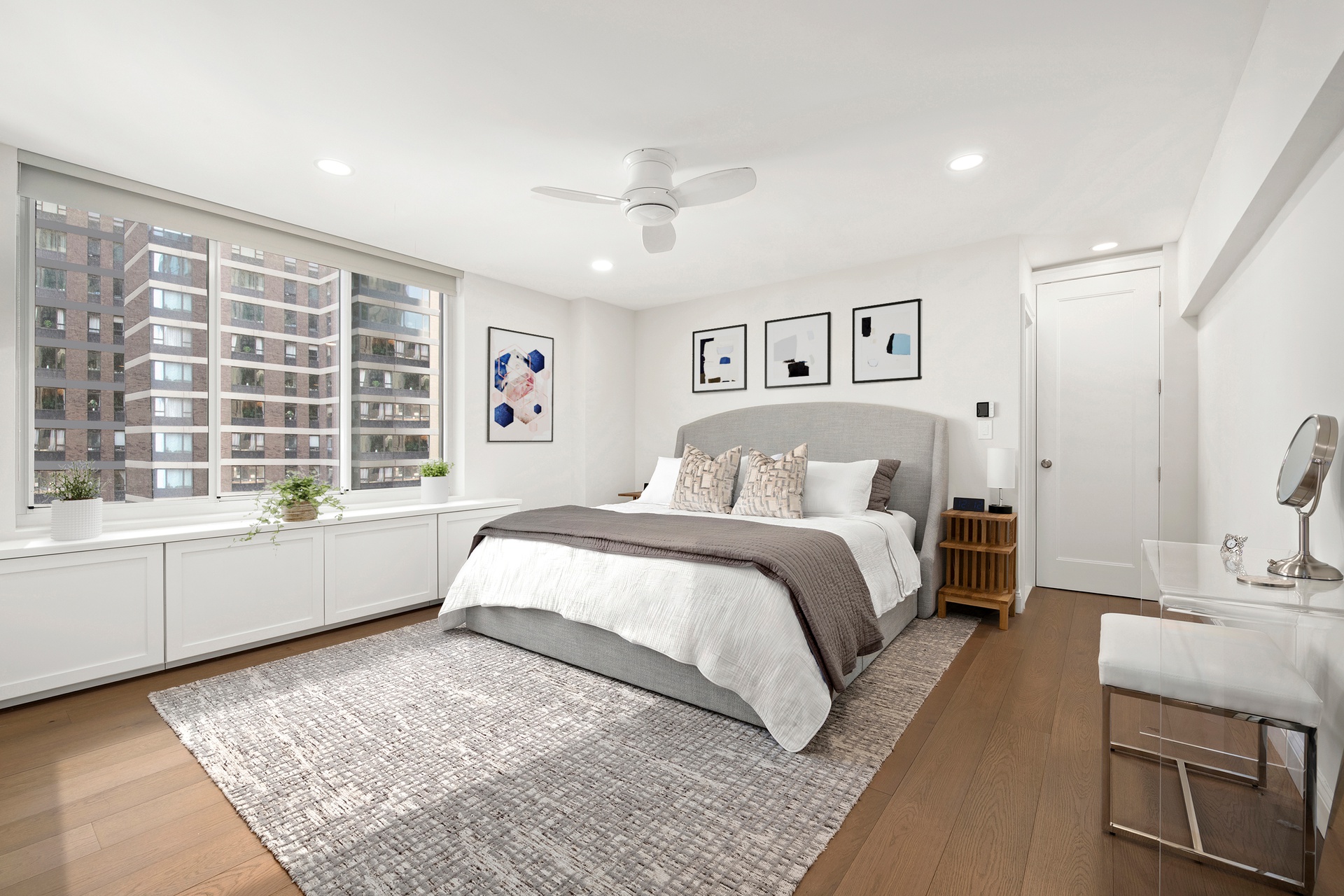 420 East 58th Street, Unit 14B Manhattan, NY 10022 - Photo 5 of 10 a spacious bedroom with a large bed and a window