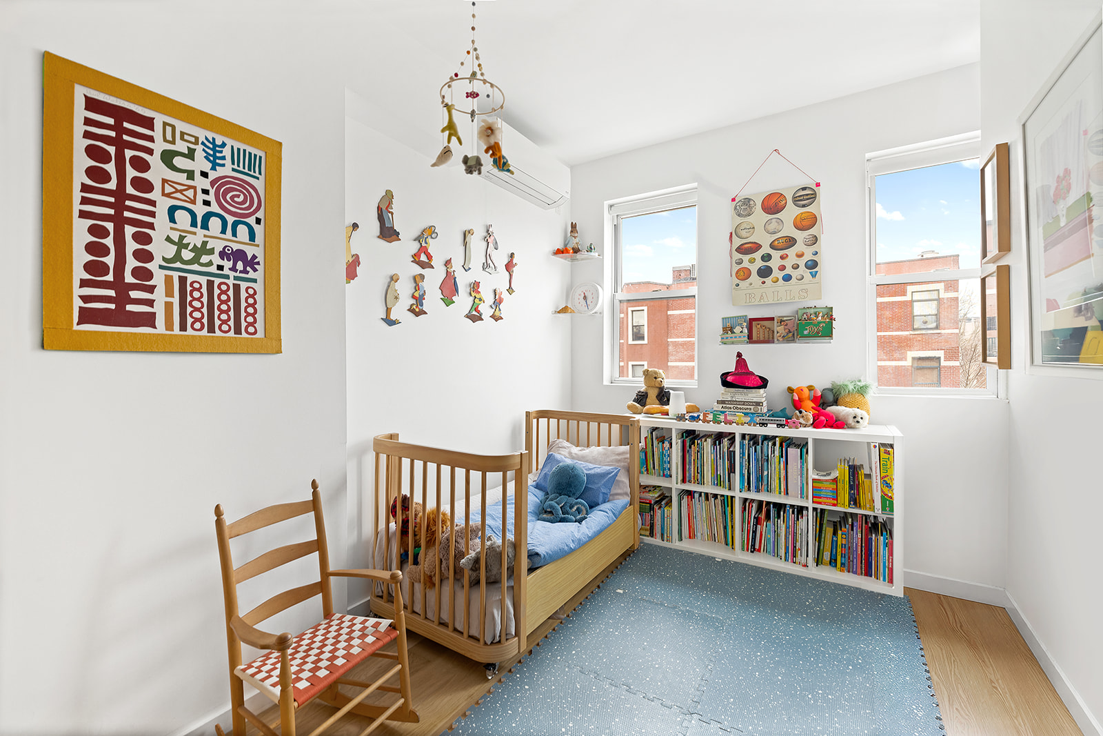 272 Putnam Avenue, Unit B Brooklyn, NY 11216 - Photo 7 of 13 a bedroom with furniture and a book shelf