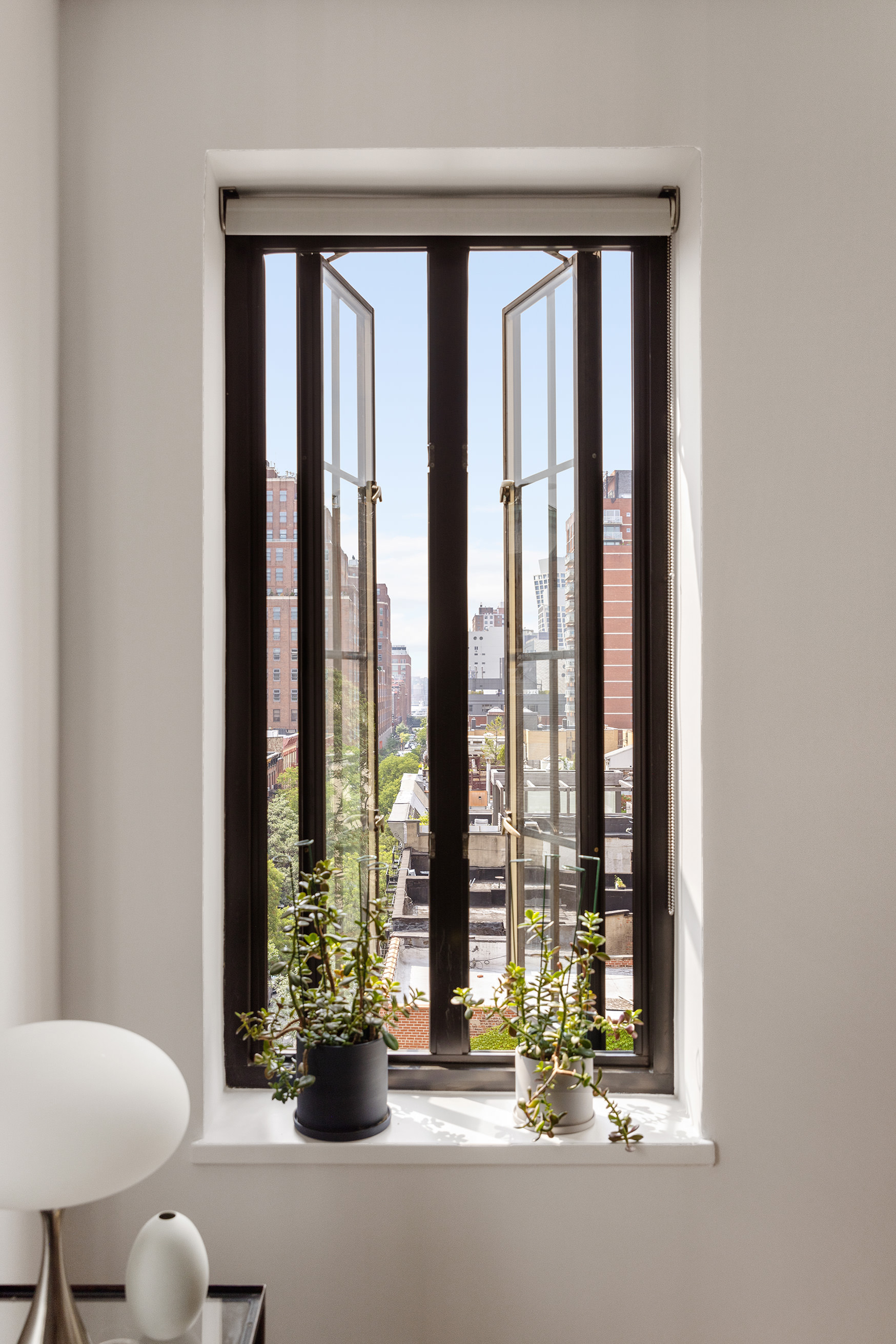 201 West 16th Street, Unit 9A Manhattan, NY 10011 - Photo 4 of 14 a view of spacious bedroom with a large window and floor to ceiling window