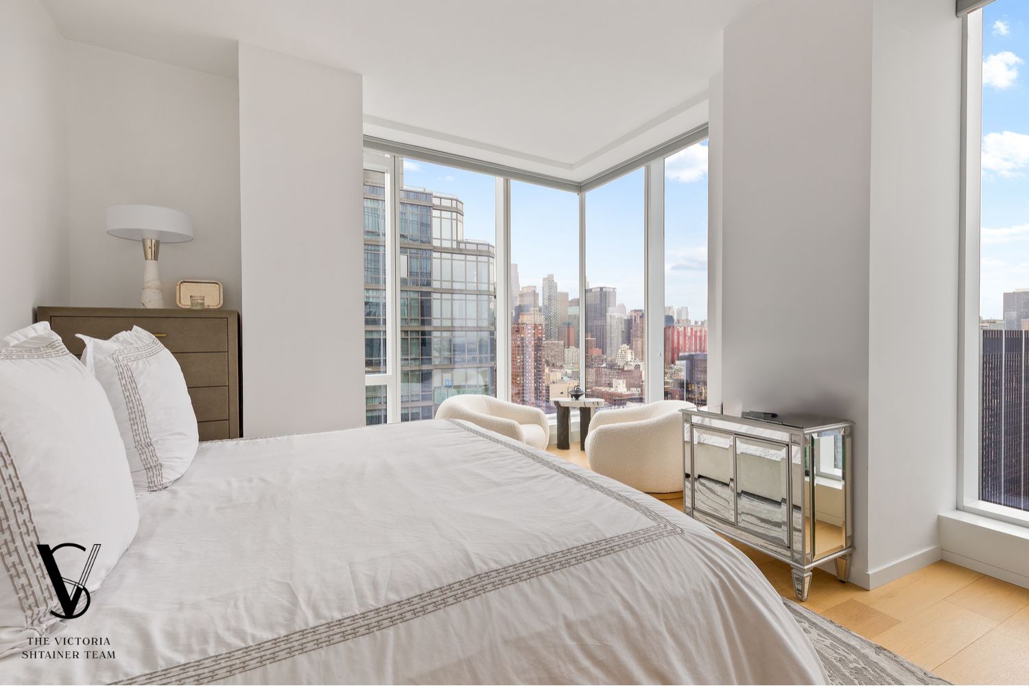 1 West End Avenue, Unit C28 Manhattan, NY 10069 - Photo 6 of 26 a bedroom with a bed and a large window